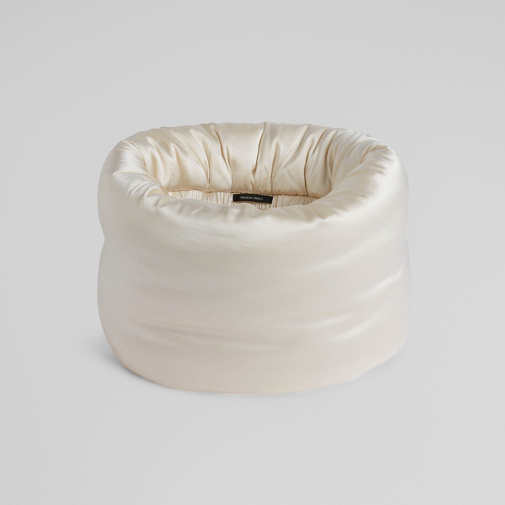 Flat front view of PILLOW SCARF in cream silk satin