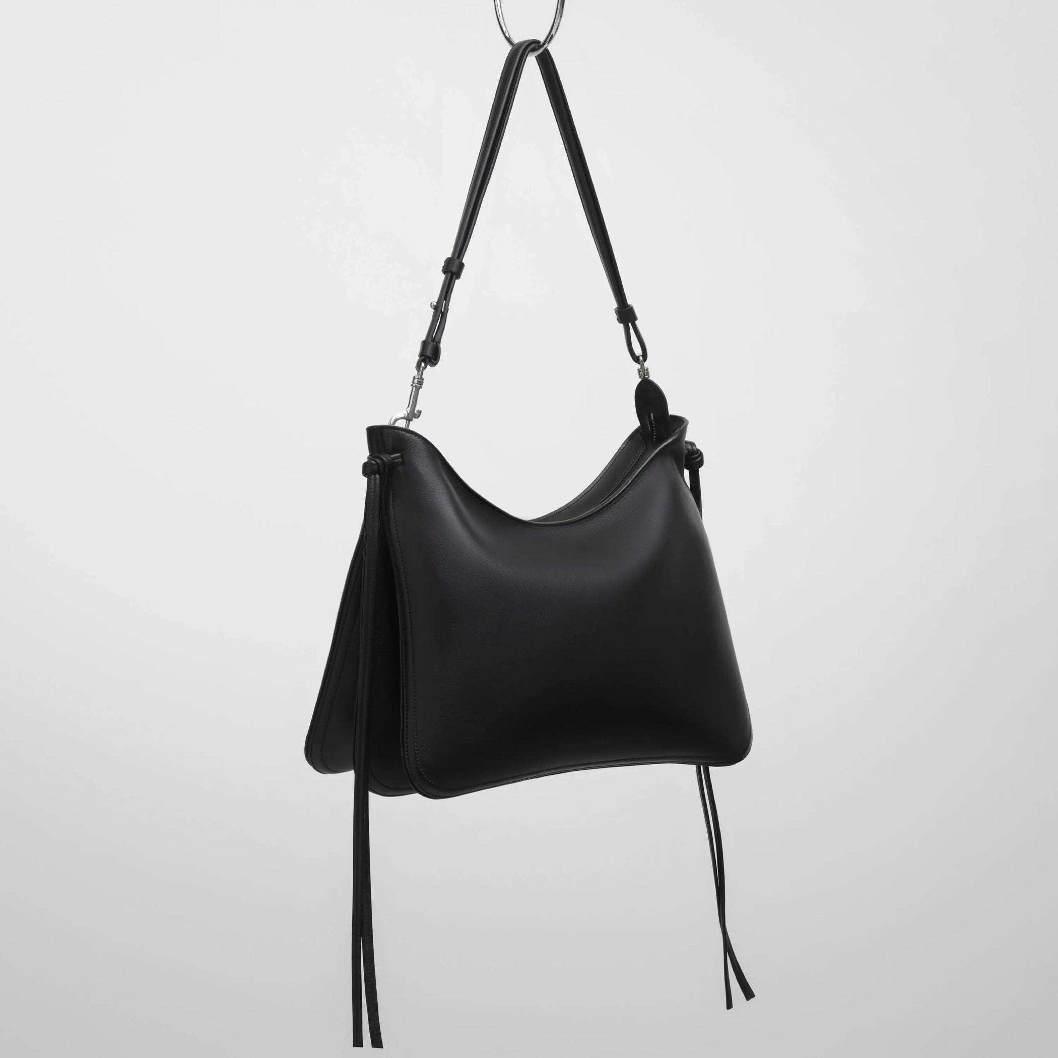 Angled view of gig bag in black leather.