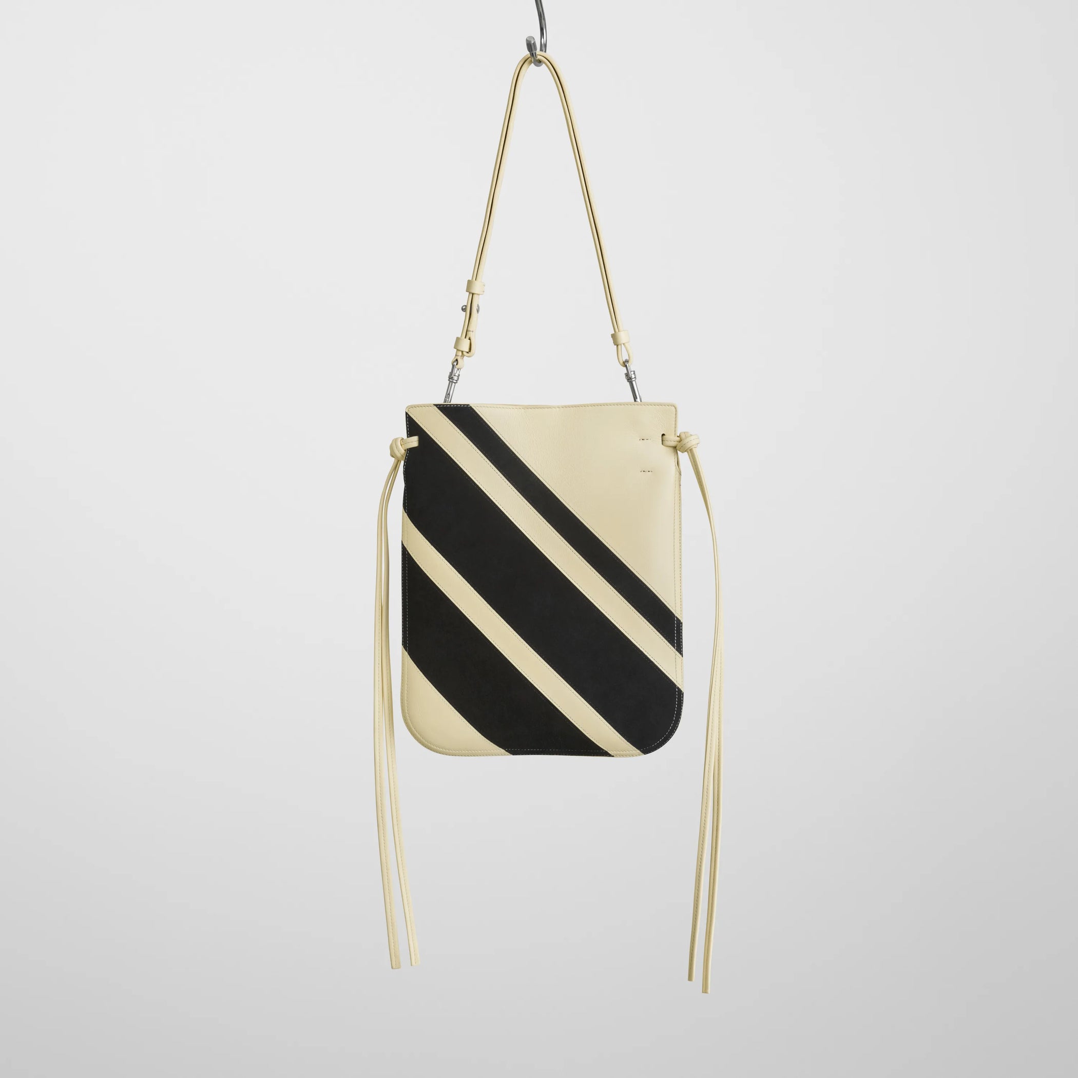 Flat front view of gig pouch in black white leather