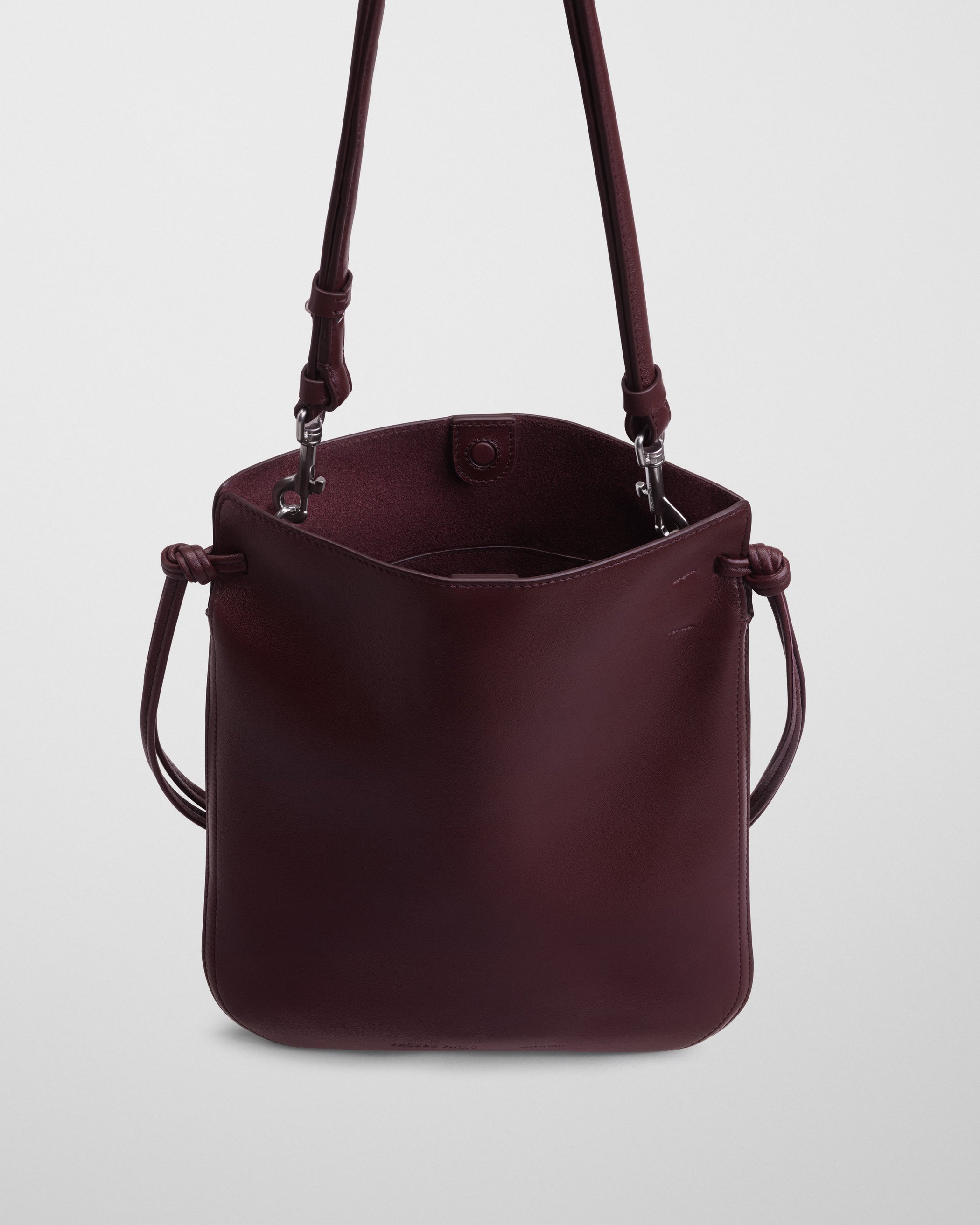 Close up detail view of GIG POUCH BAG in oxblood leather