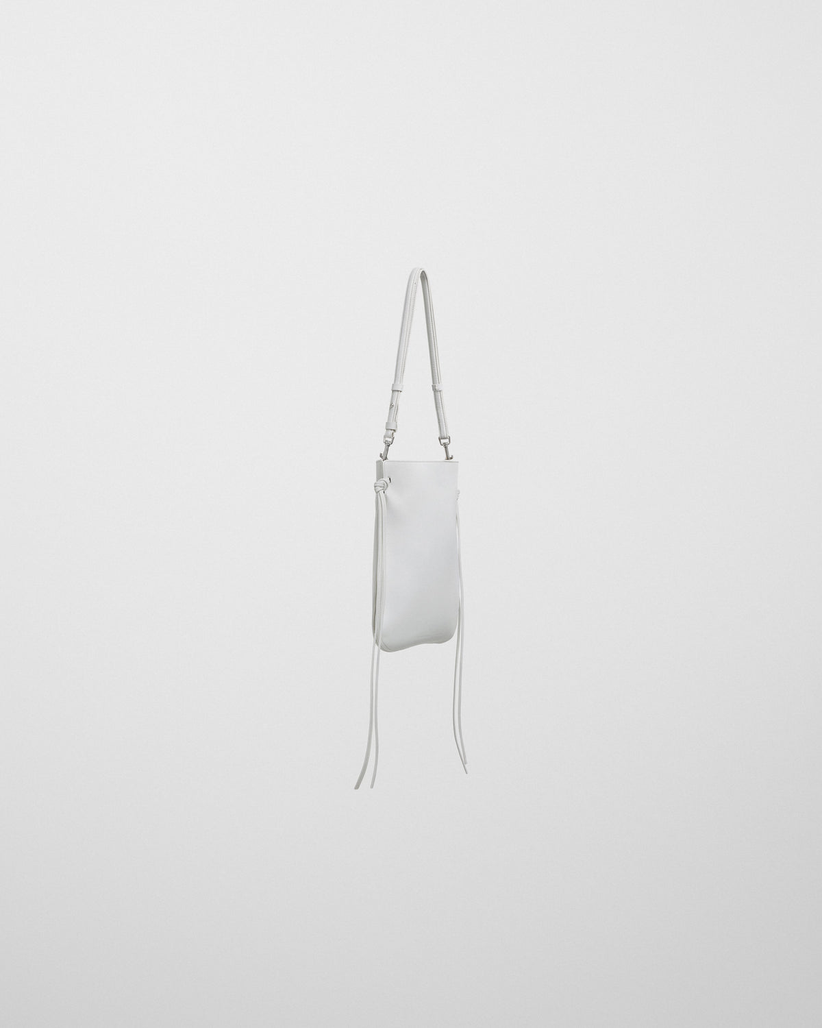 Side view of GIG POUCH in white leather with silver
