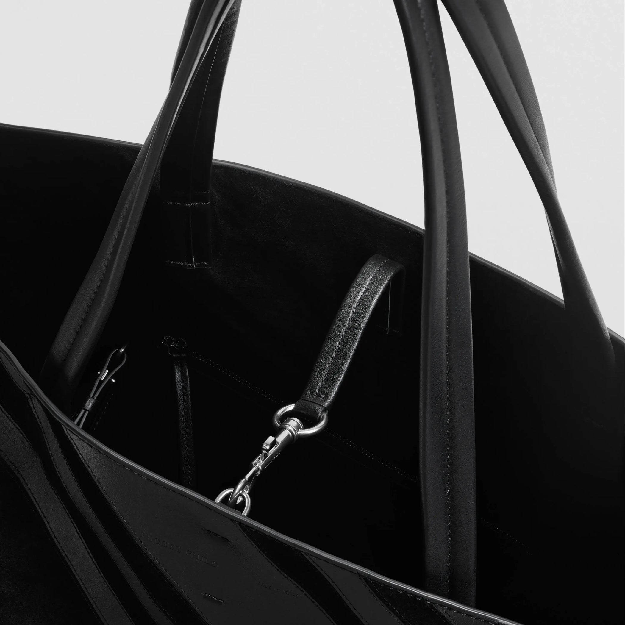 Close up detail view of basket cabas in black leather and suede with silver