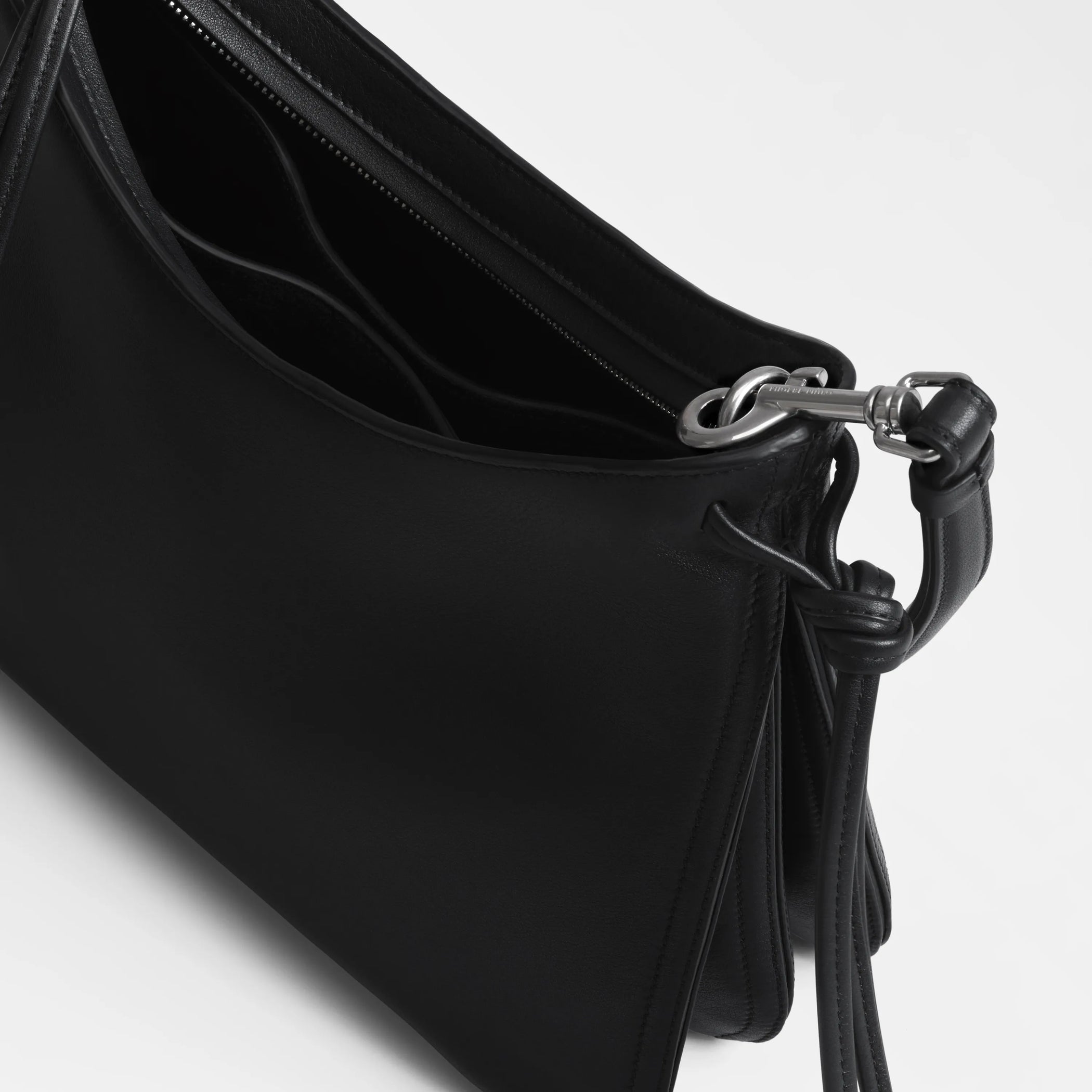 Close up detail view of small gig in black leather.
