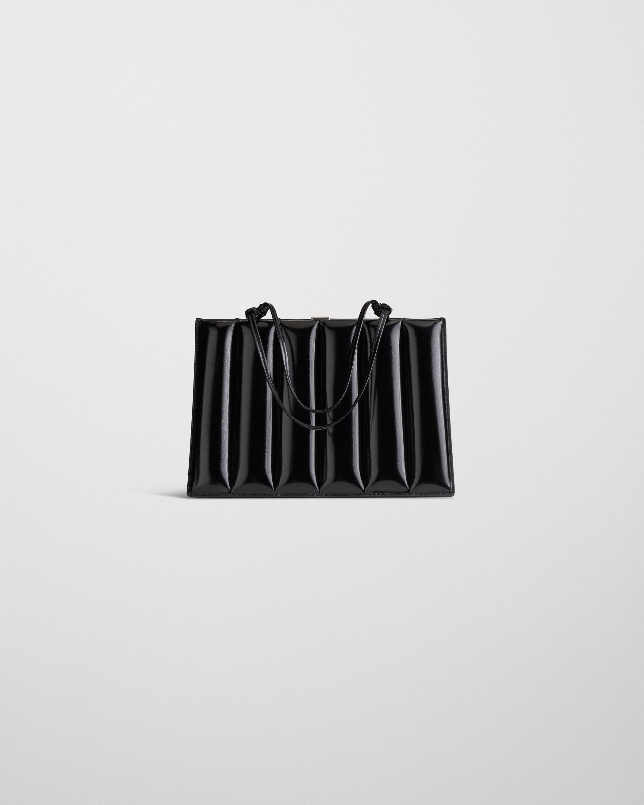 Flat front view image of the DRIVE BAG in black leather