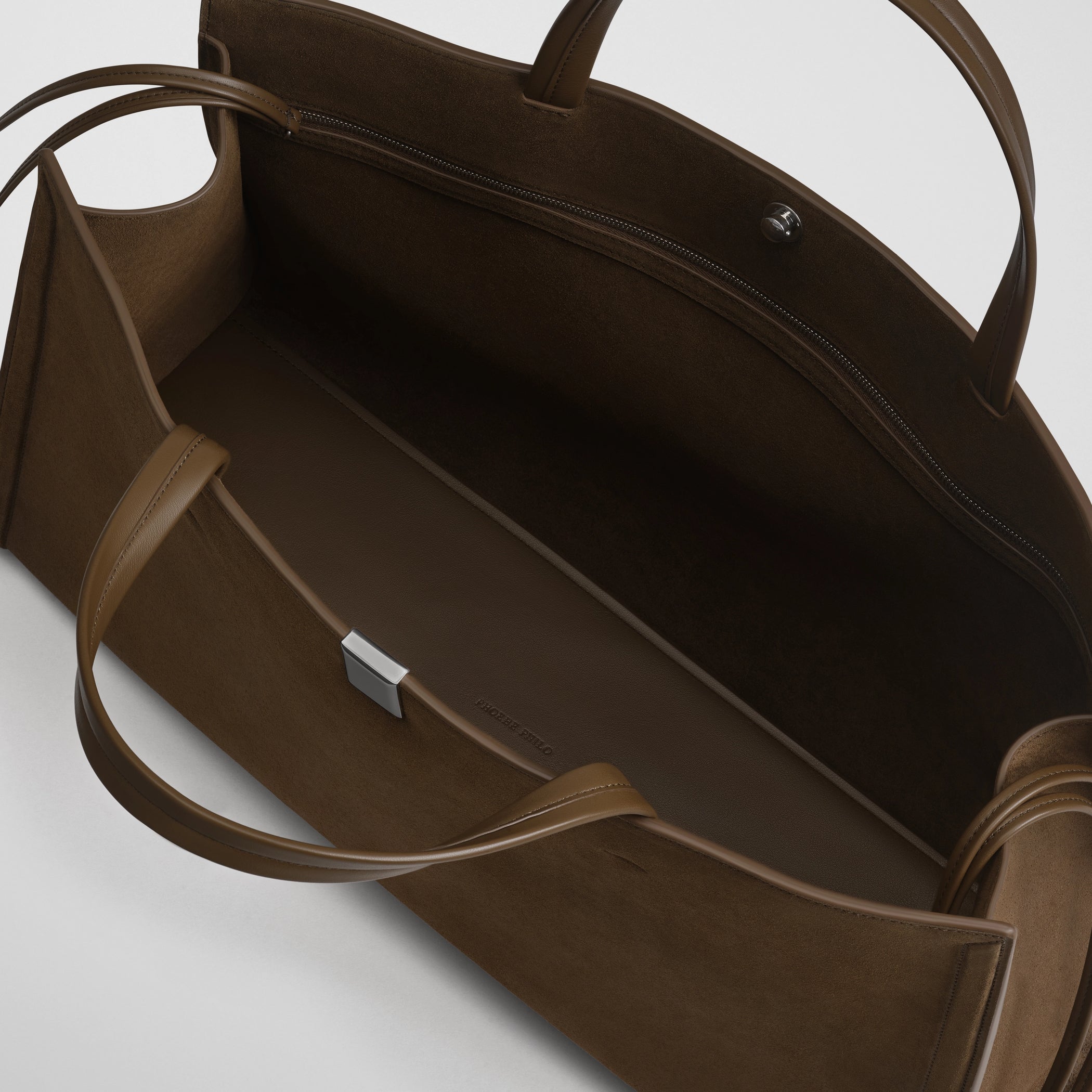 Close up detail view of medium kit cabas in khaki suede leather.
