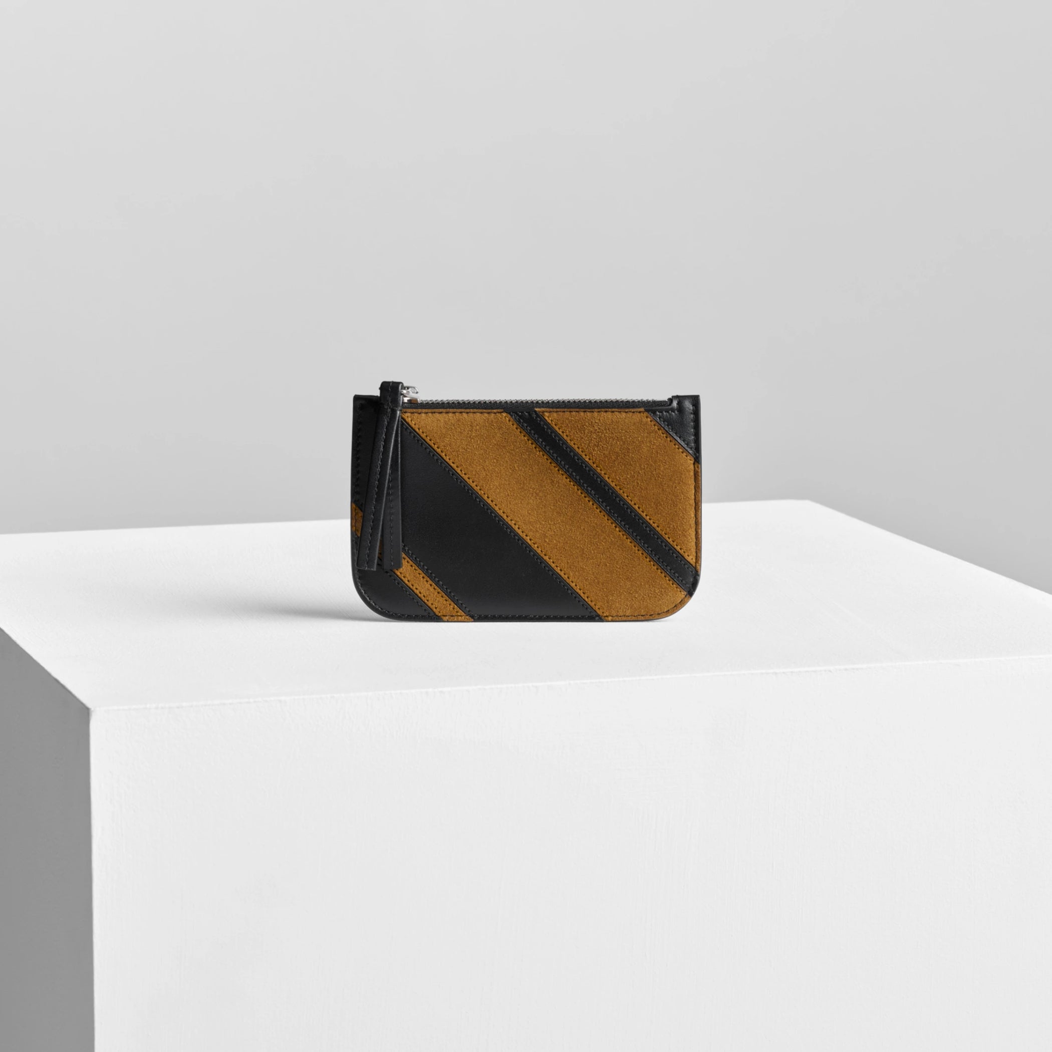 Front view of pocket card holder in toffee/black leather.