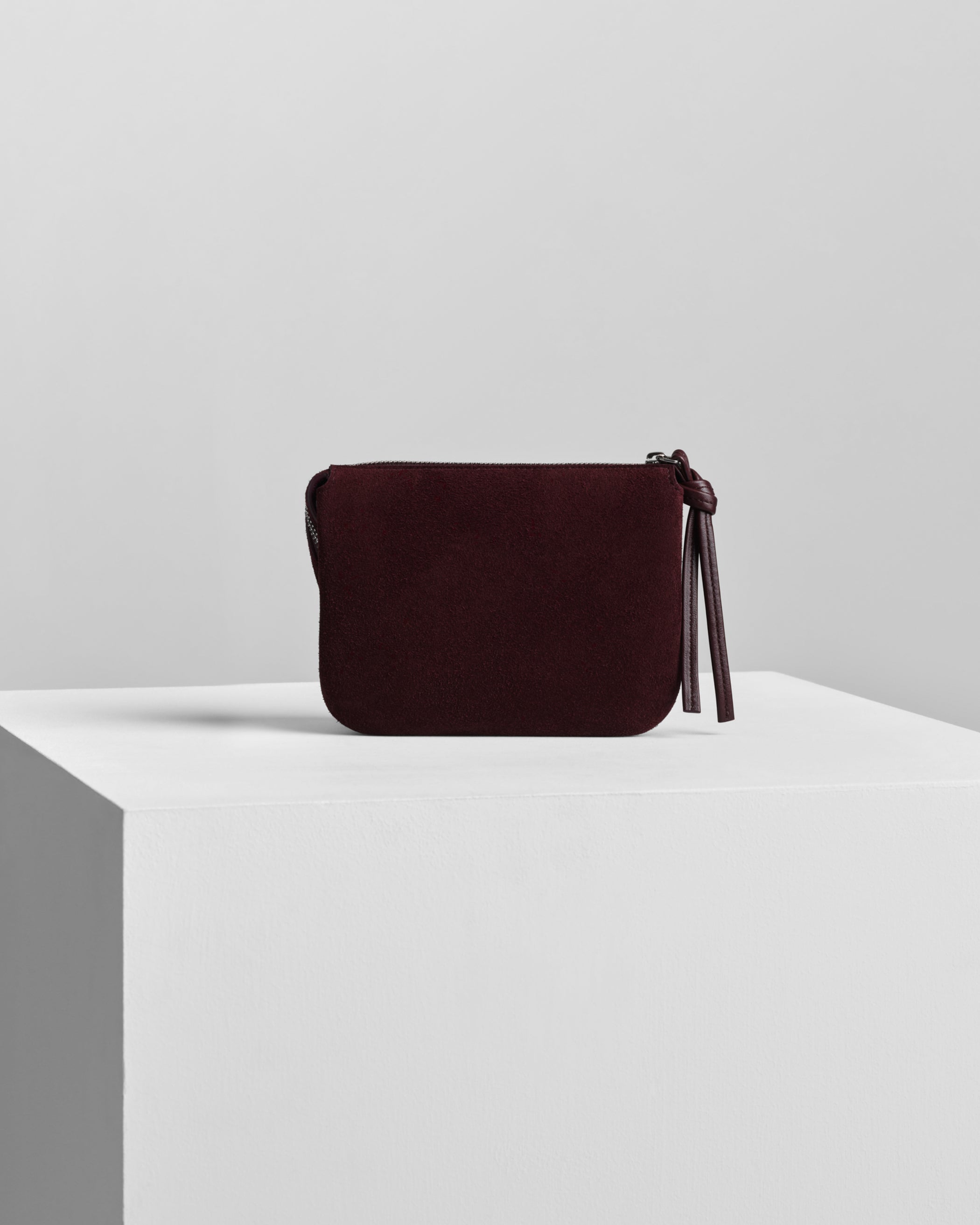 Back view of POCKET GIG in oxblood suede leather