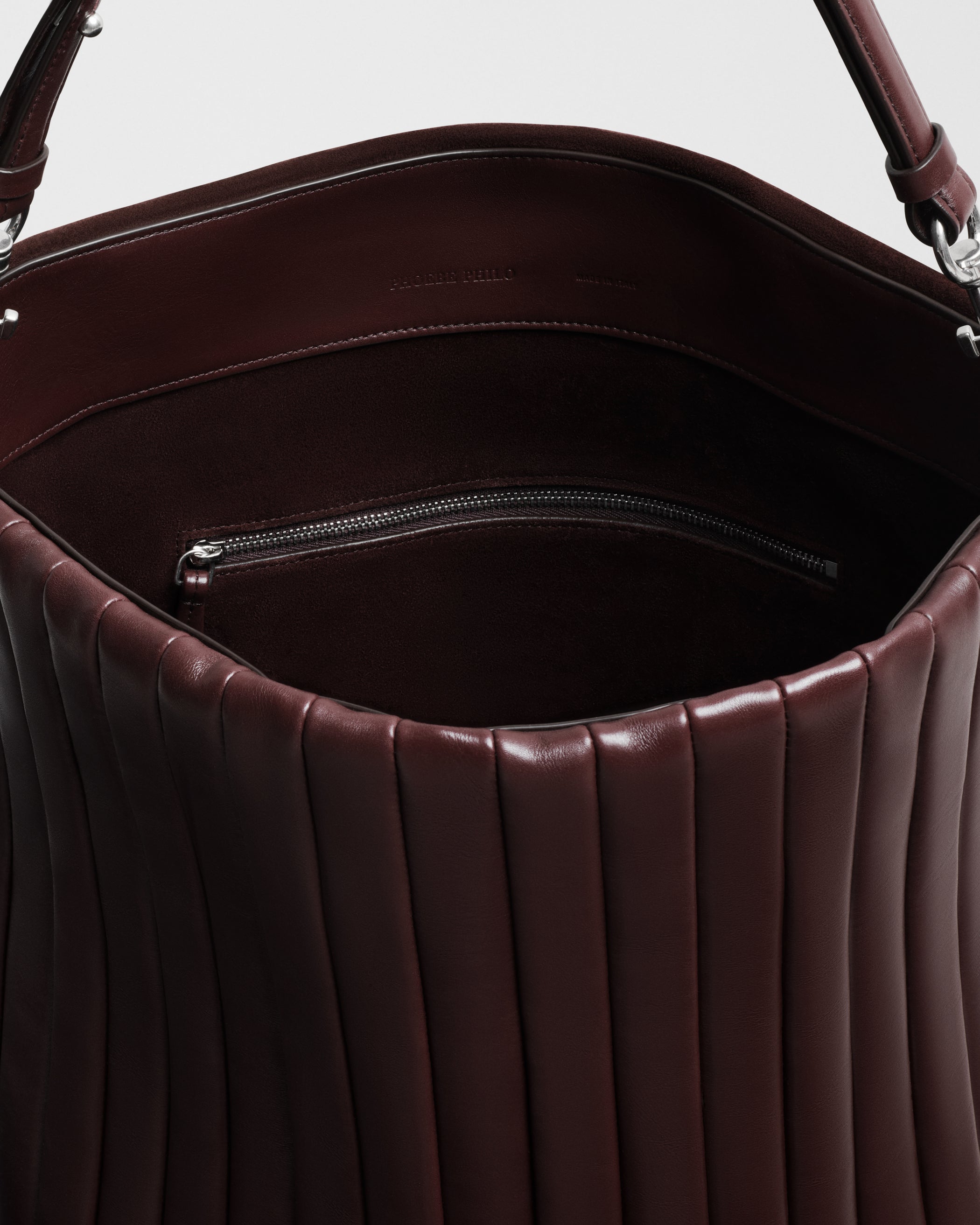 Close up detail view of ACCORDION BAG in oxblood leather
