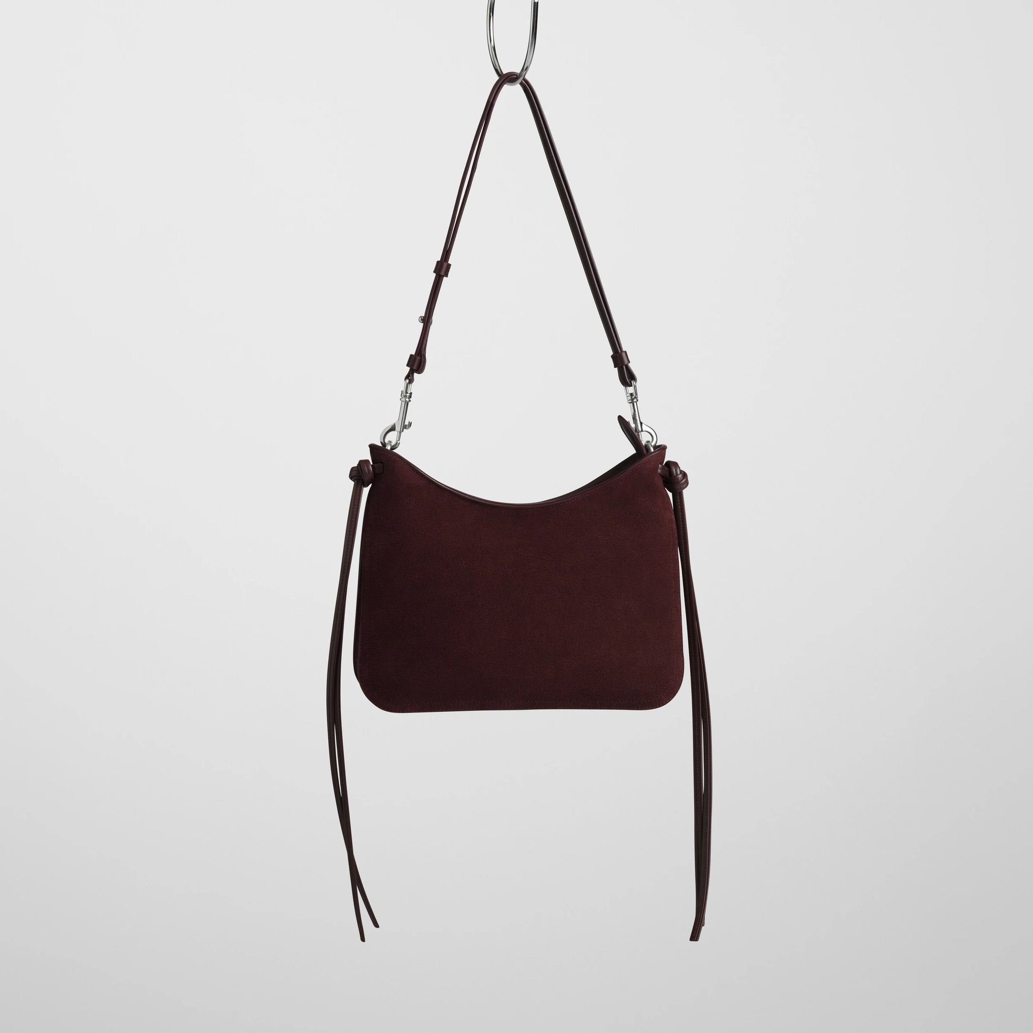 Front view of small gig bag in oxblood suede leather.
