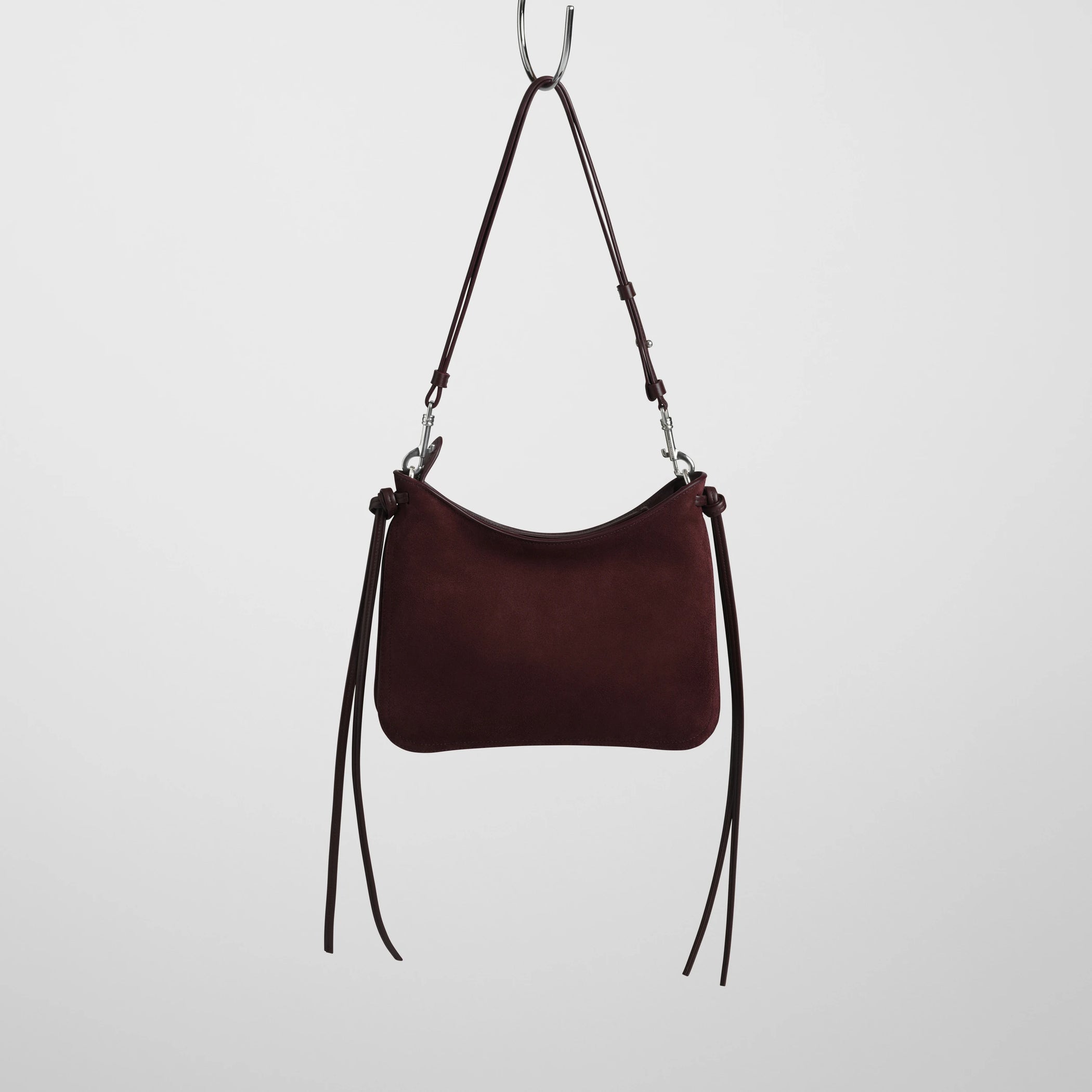 Back view of small gig bag in oxblood suede leather.