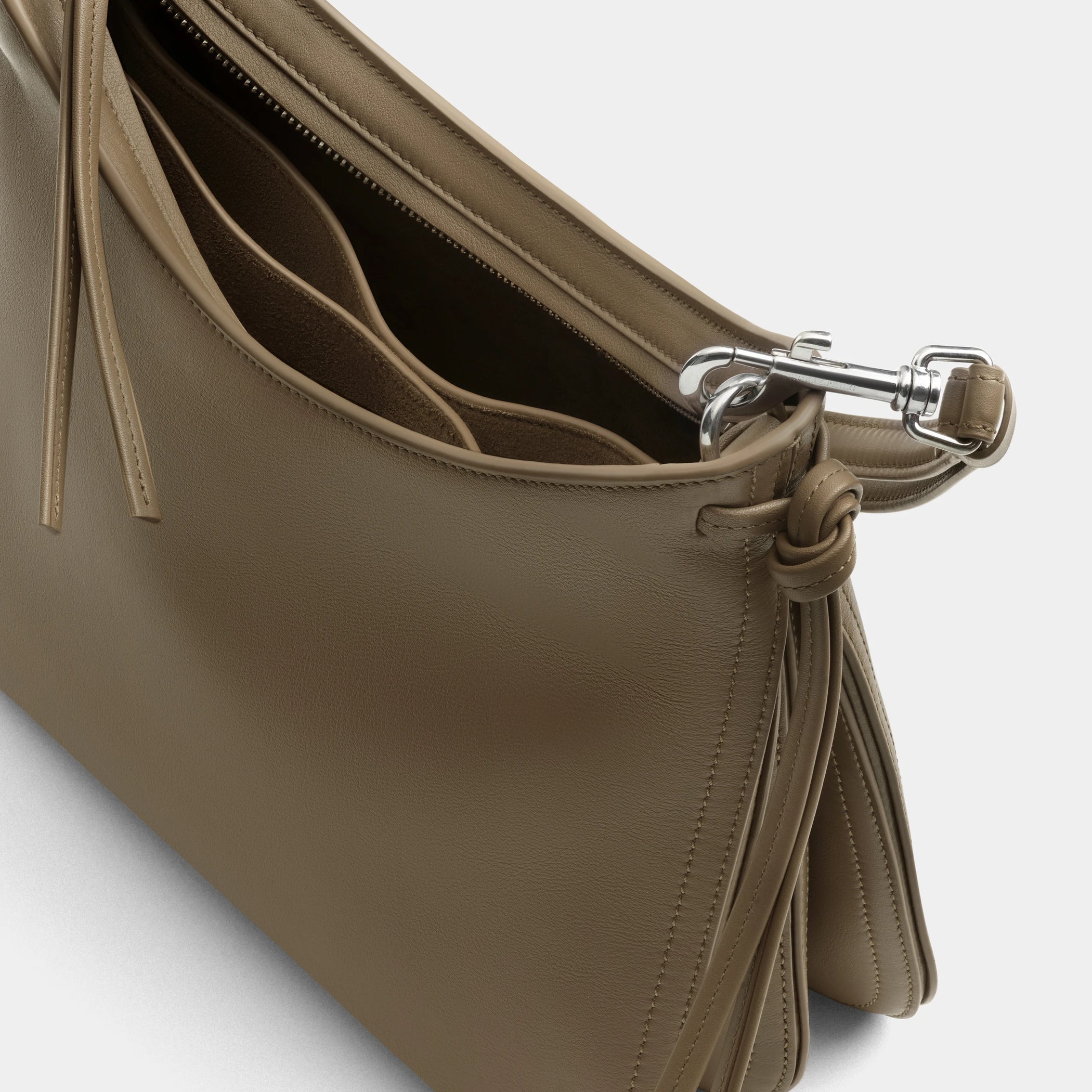 Close up detail view of small gig bag in cookie leather.