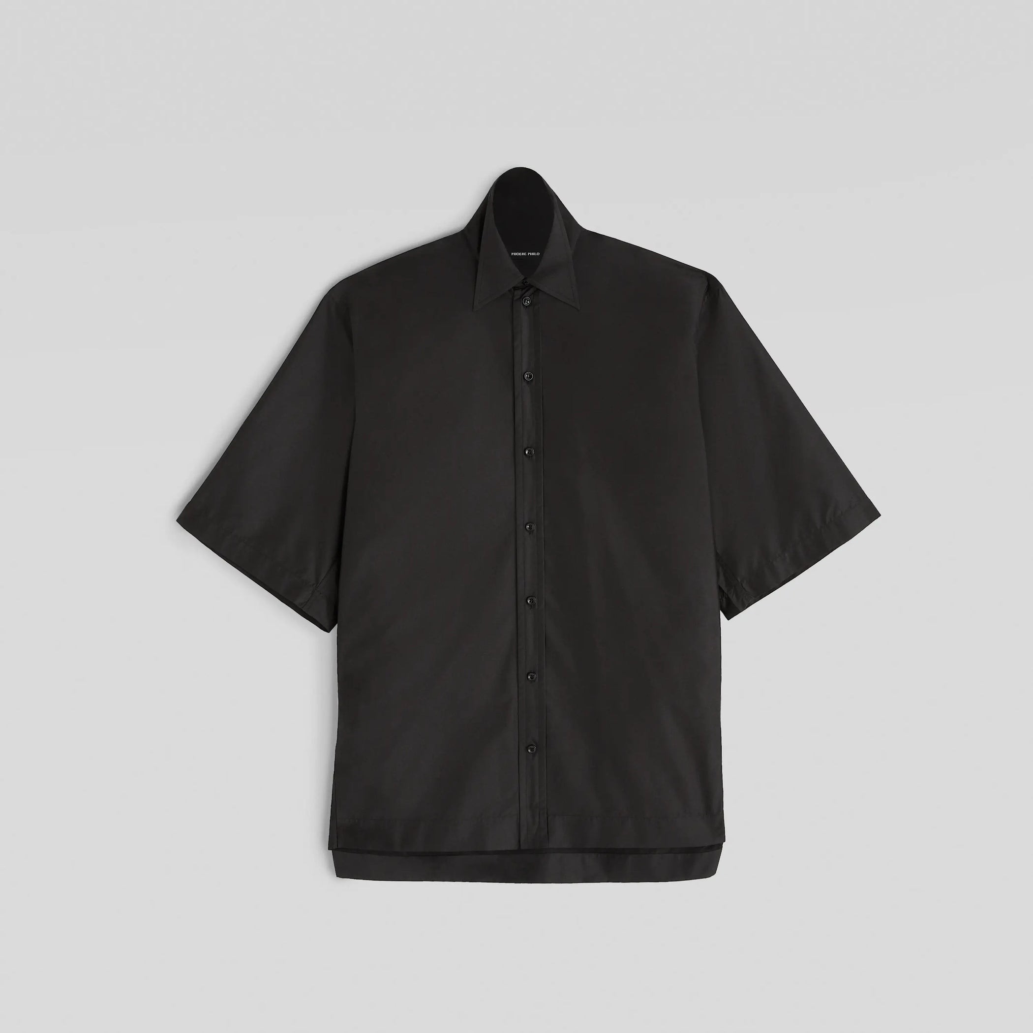 Flat front view of short sleeve shirt in black technical taffeta 