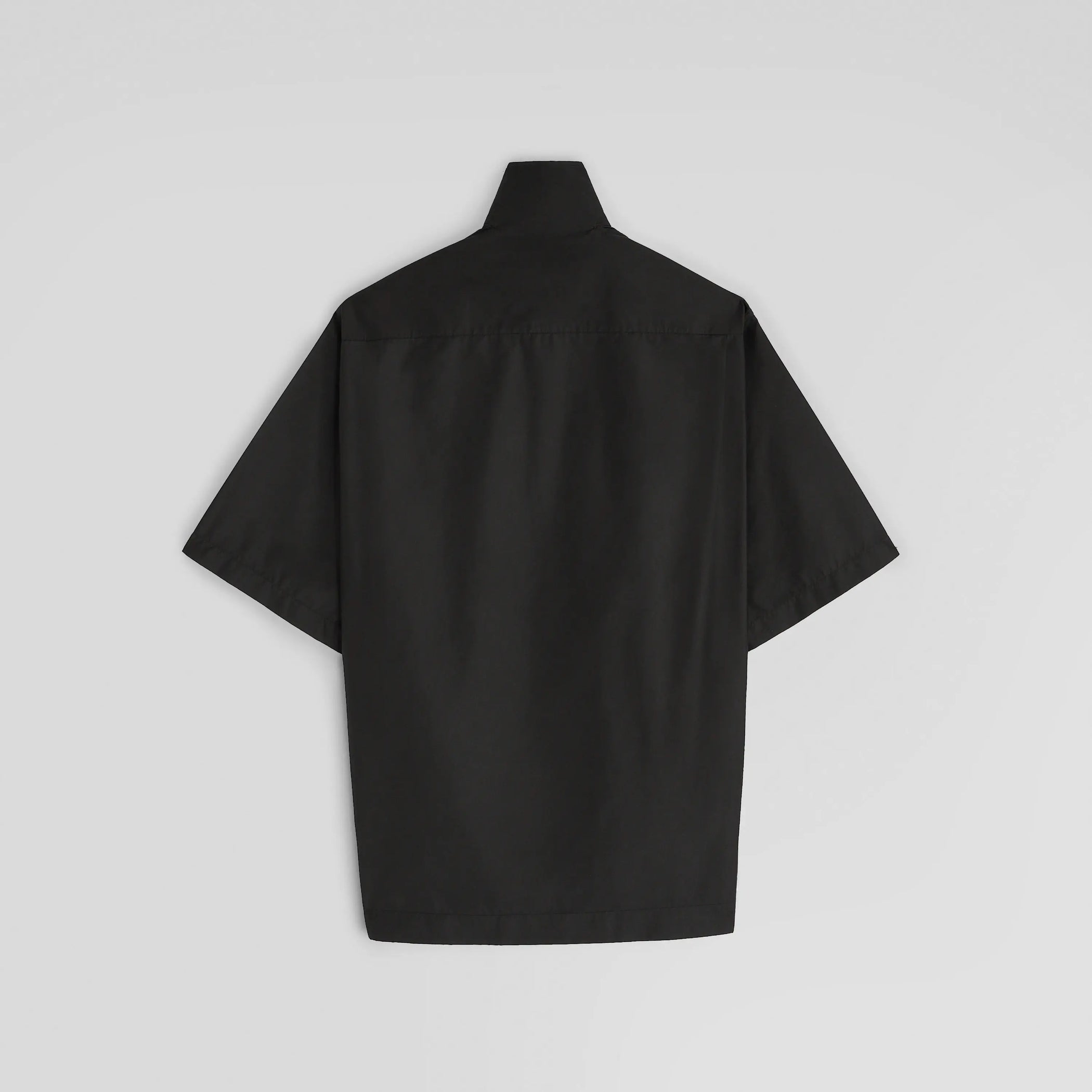 Flat back view of short sleeve shirt in black technical taffeta