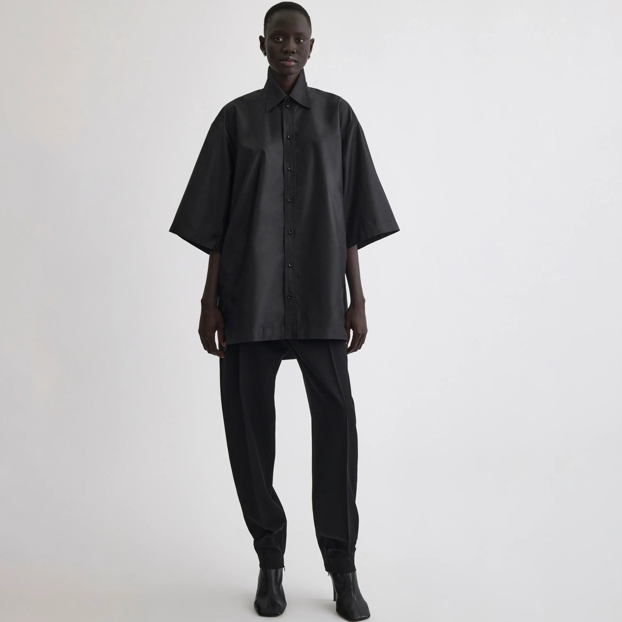 Front view of short sleeve shirt in black technical taffeta