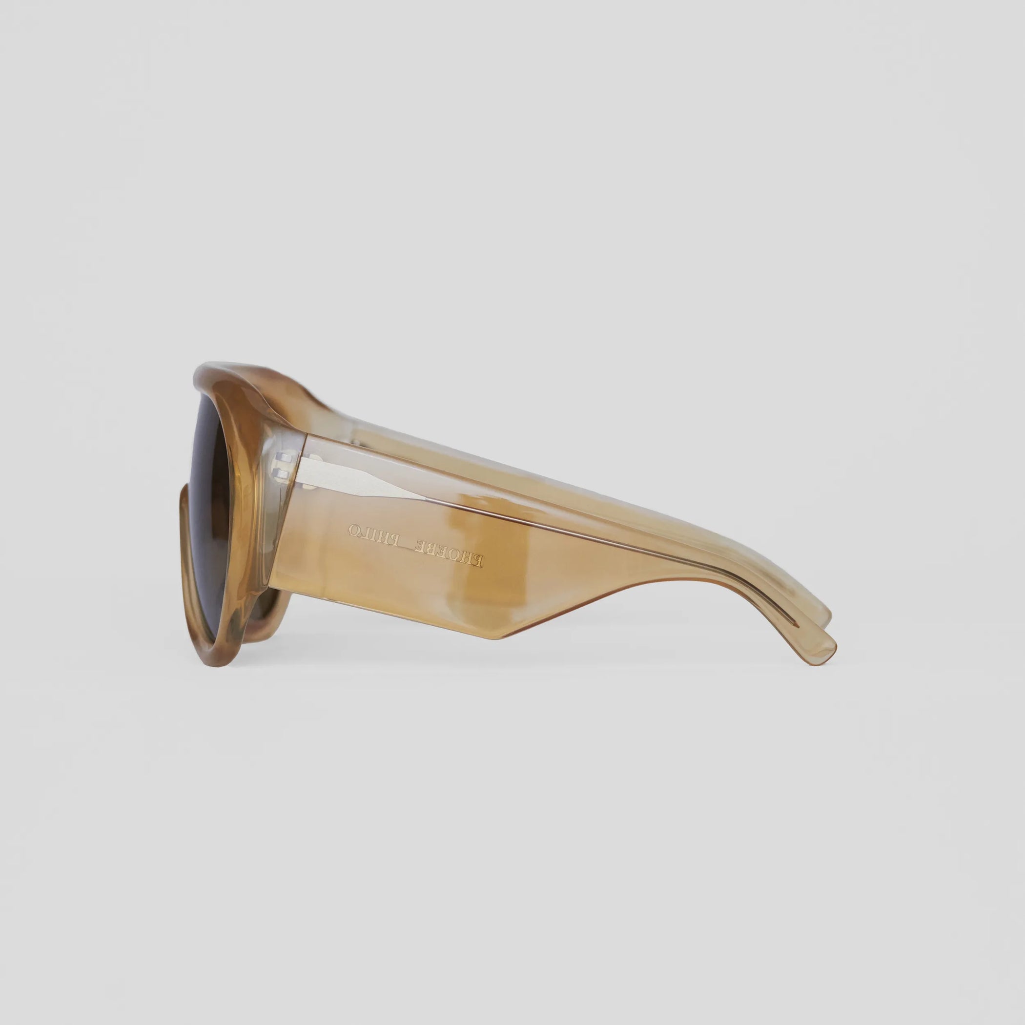 Side view of bombé sunglasses in caramel acetate.