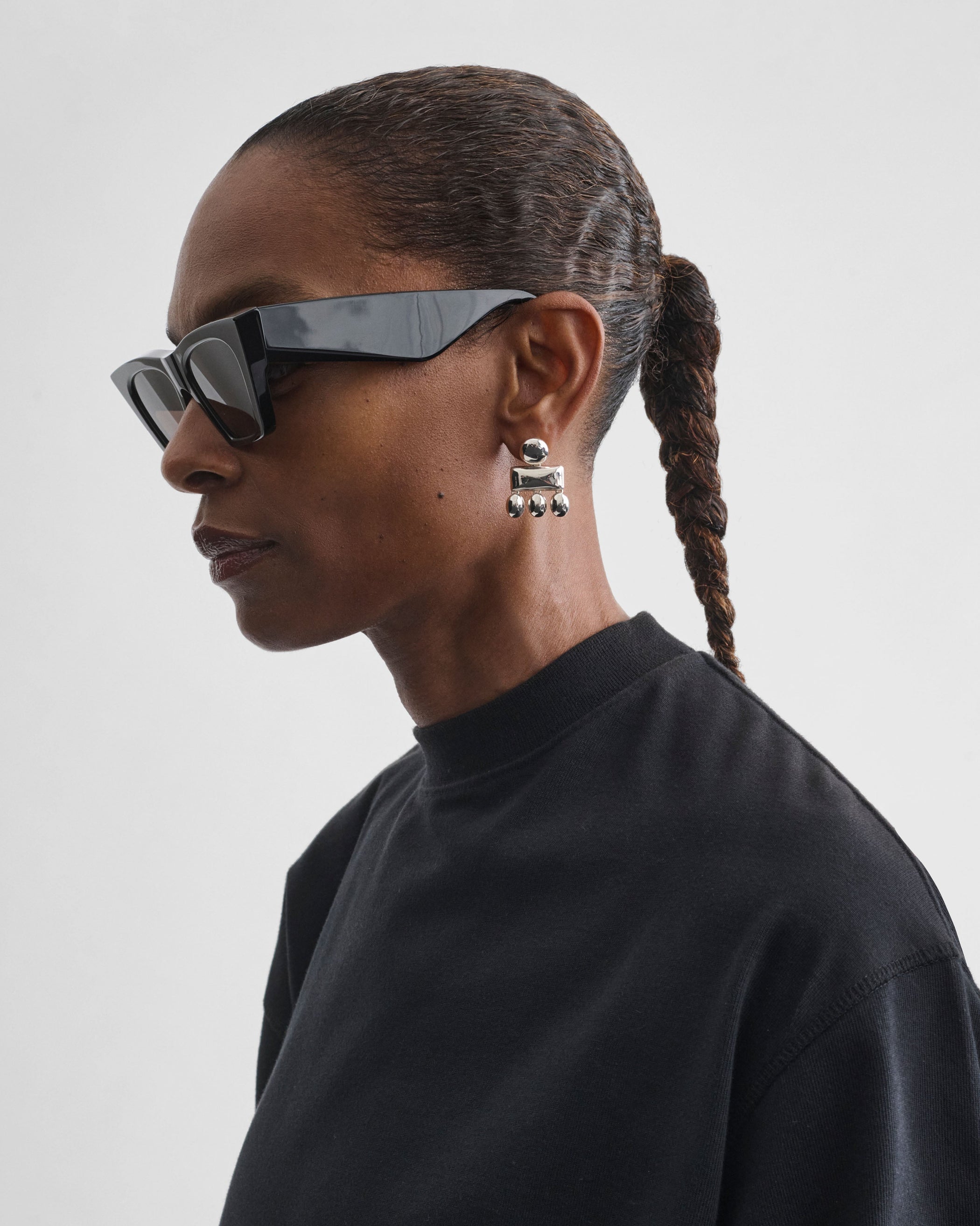 Side view of model wearing MINI CHANDELIER EARRINGS in sterling silver