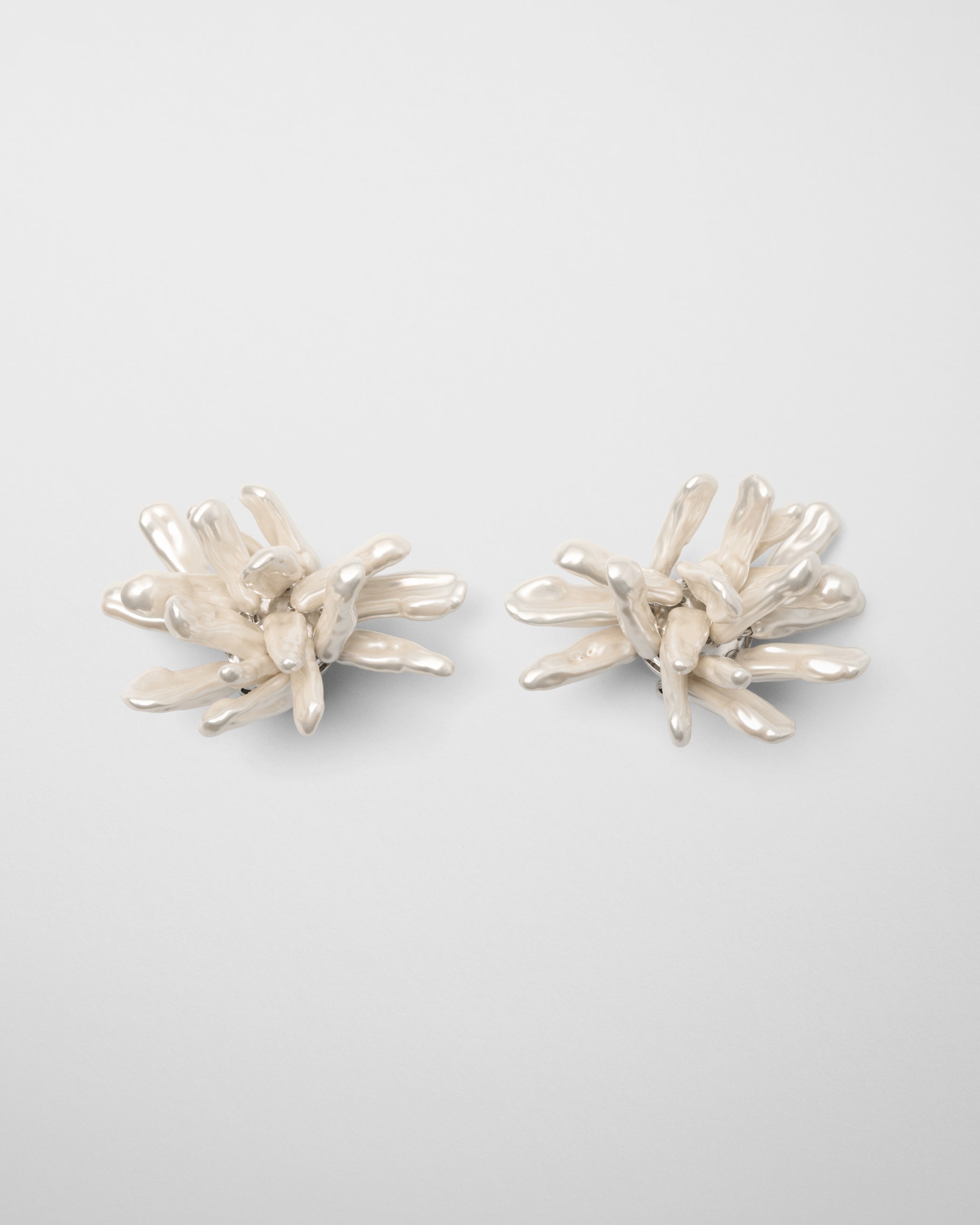 Front view of CLUSTER EARRINGS in silver cream resin