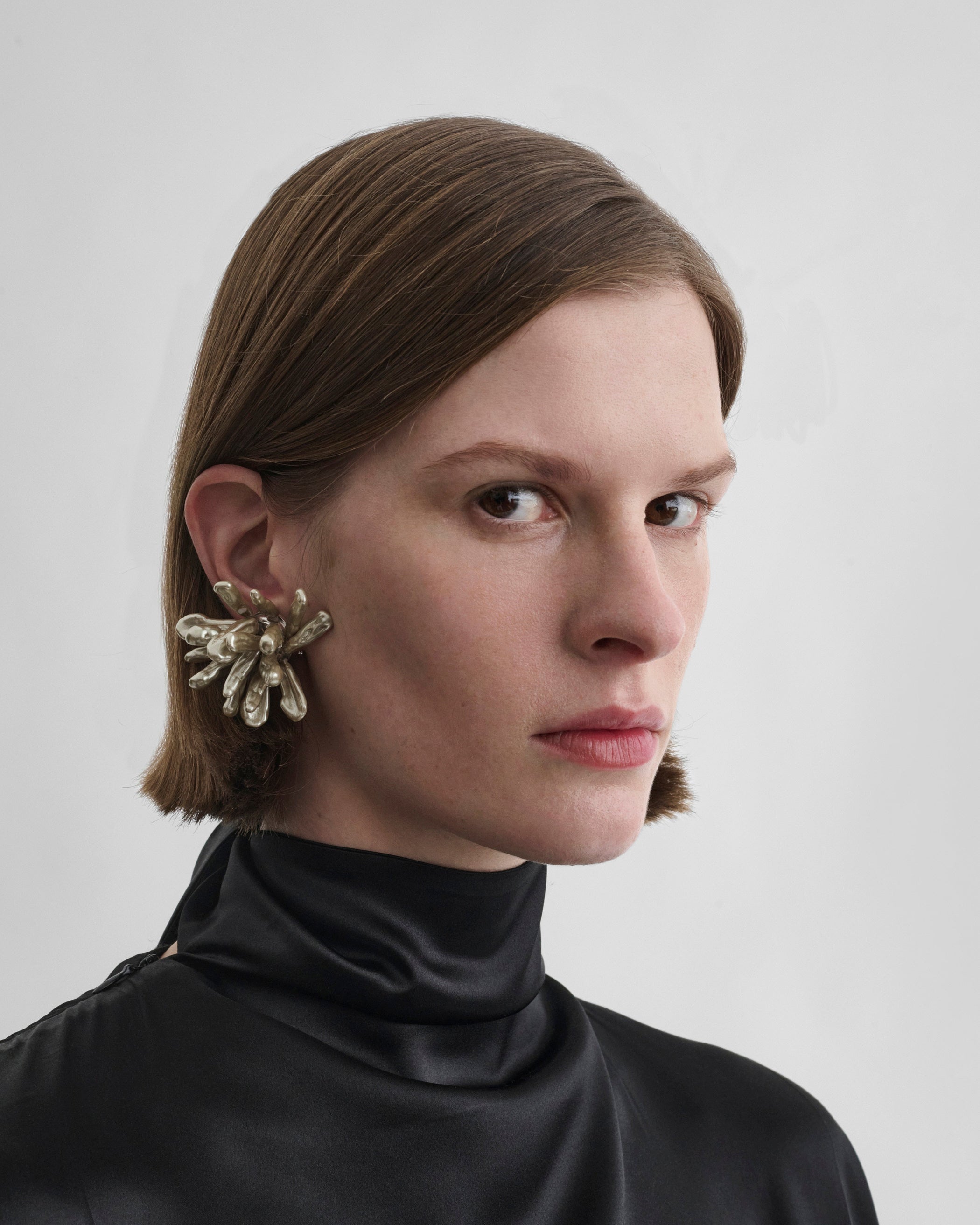 Front view of model wearing CLUSTER EARRINGS in mink/ash resin