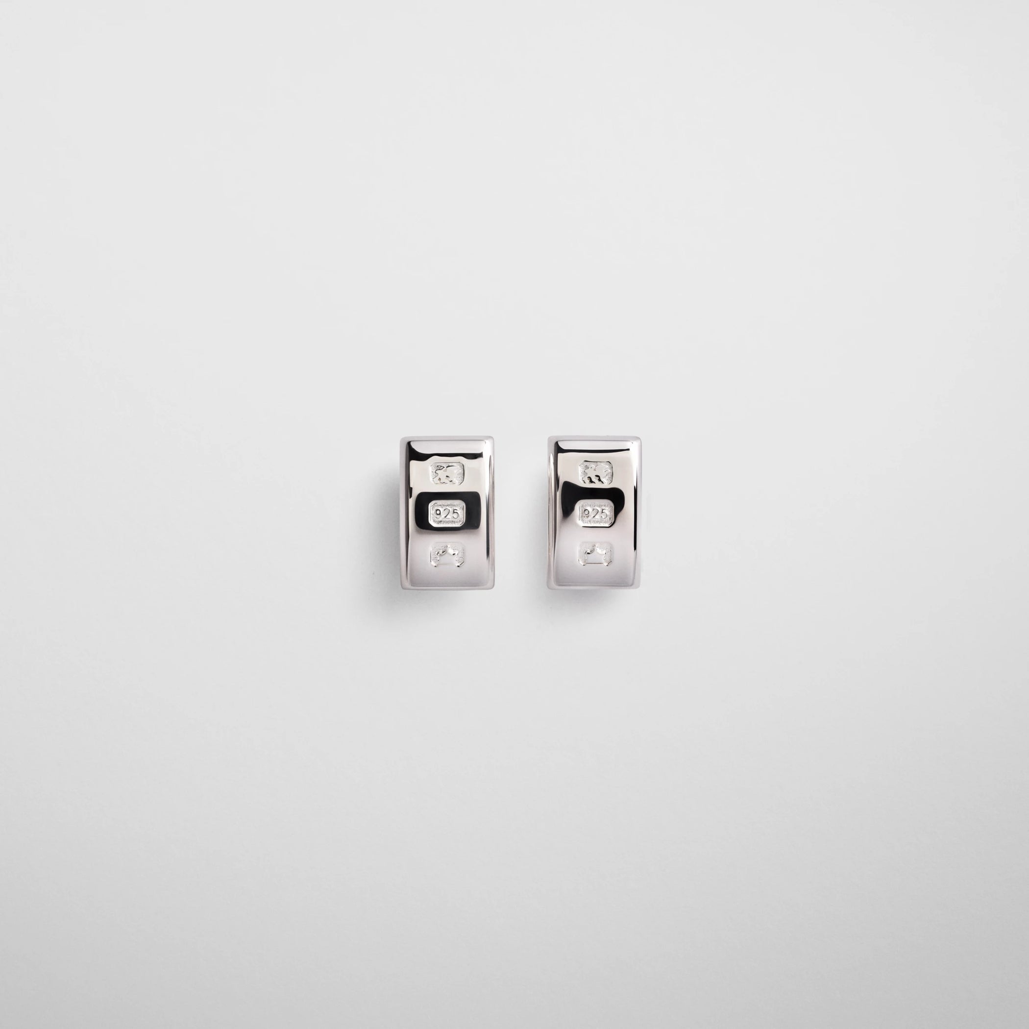 Flat front view of hallmark earrings in sterling silver.