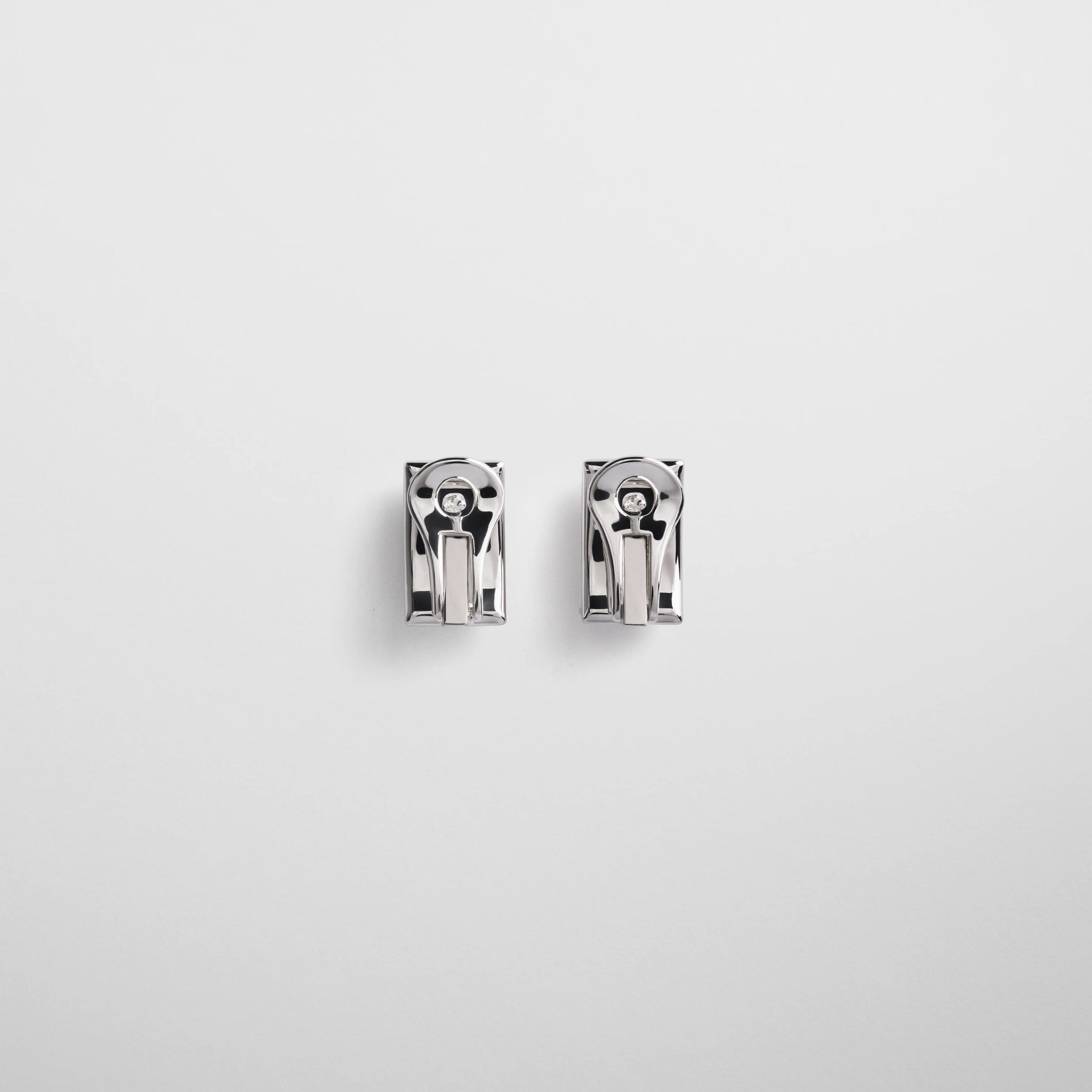 Flat back view of hallmark earrings in sterling silver.
