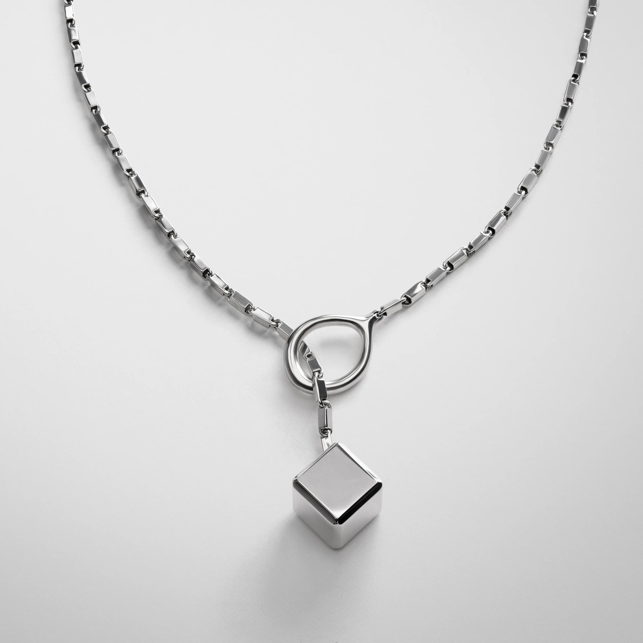 Close up detail view of hoop tie pendant in sterling silver.