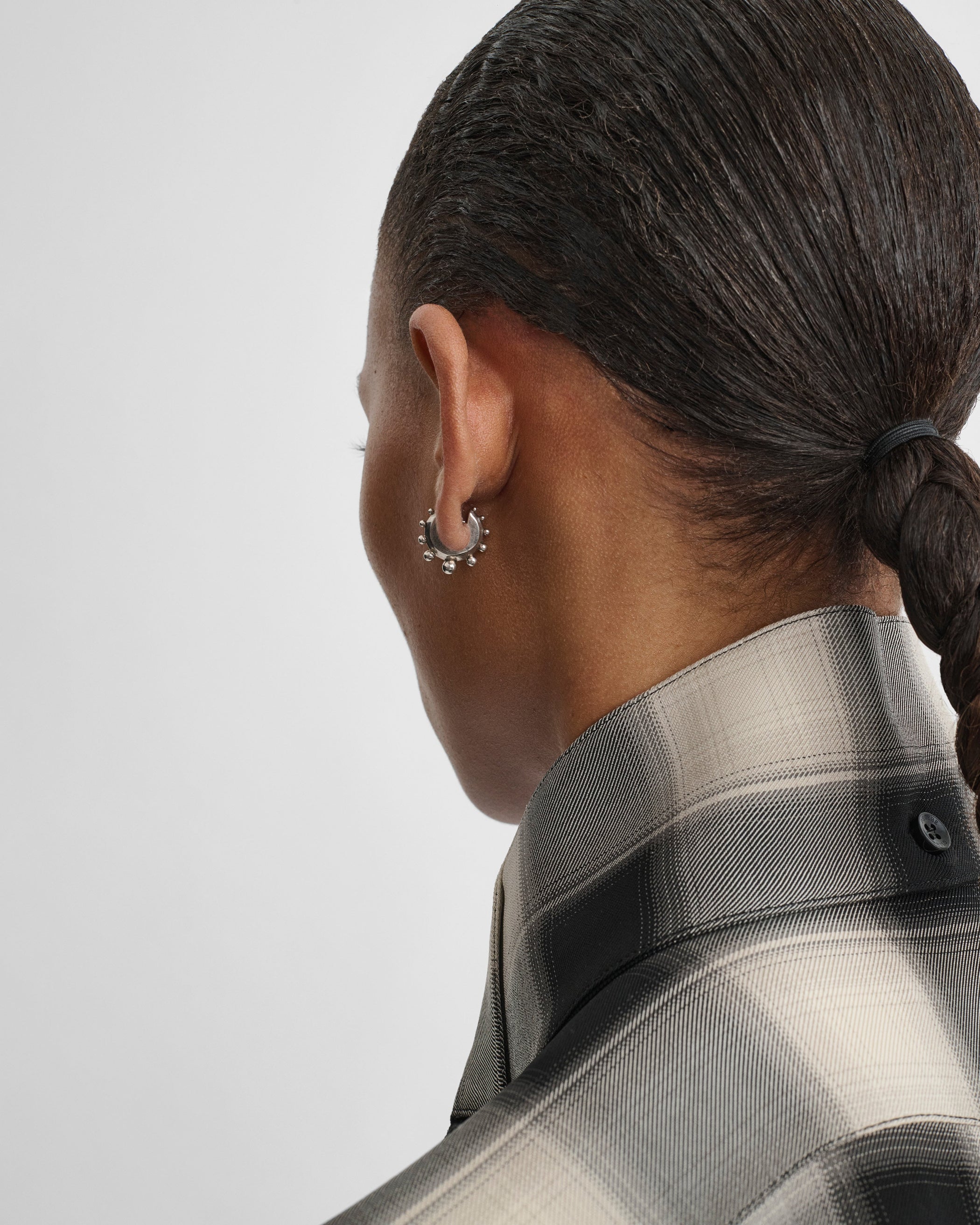 Model wearing BEADED HOOP EARRINGS SMALL in sterling silver