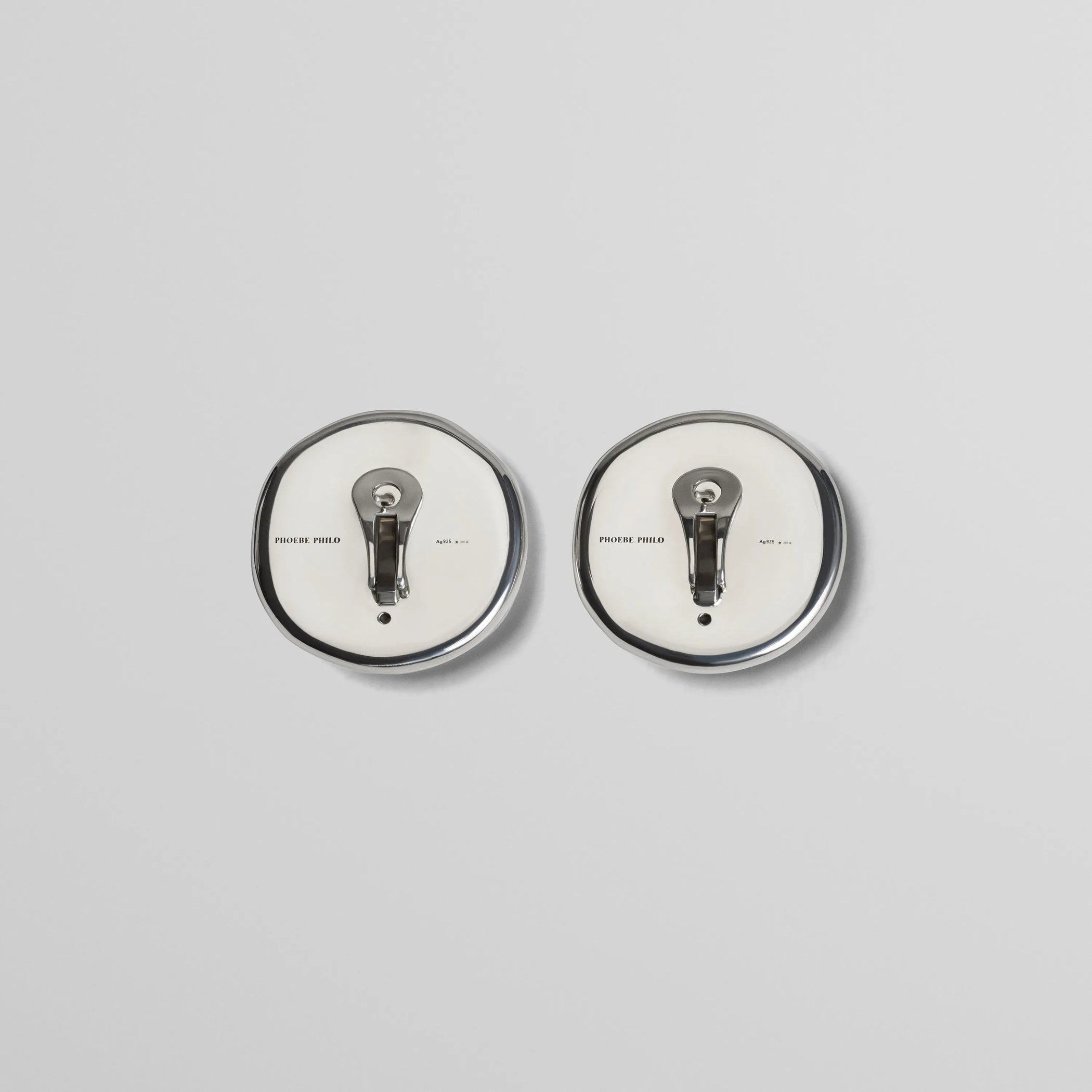 Flat back view of medallion dish earrings in sterling silver