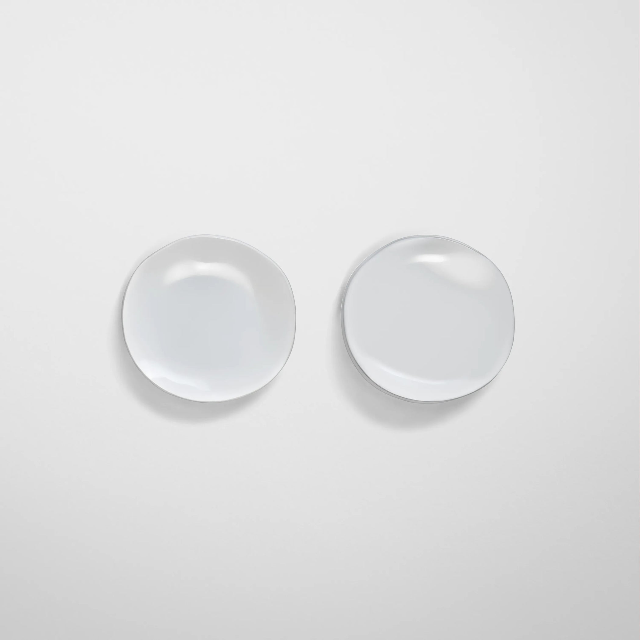 Front view of medallion earrings in white