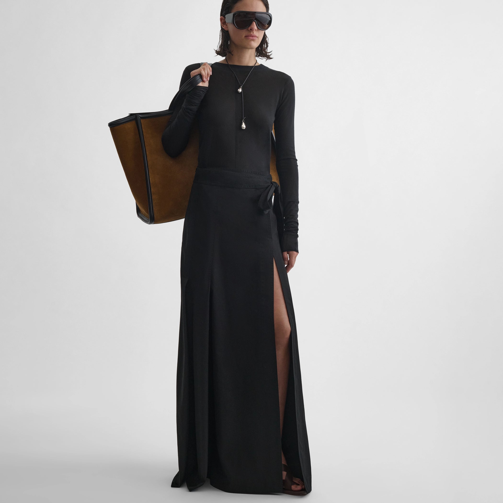 Front view of model wearing the wrap skirt in black