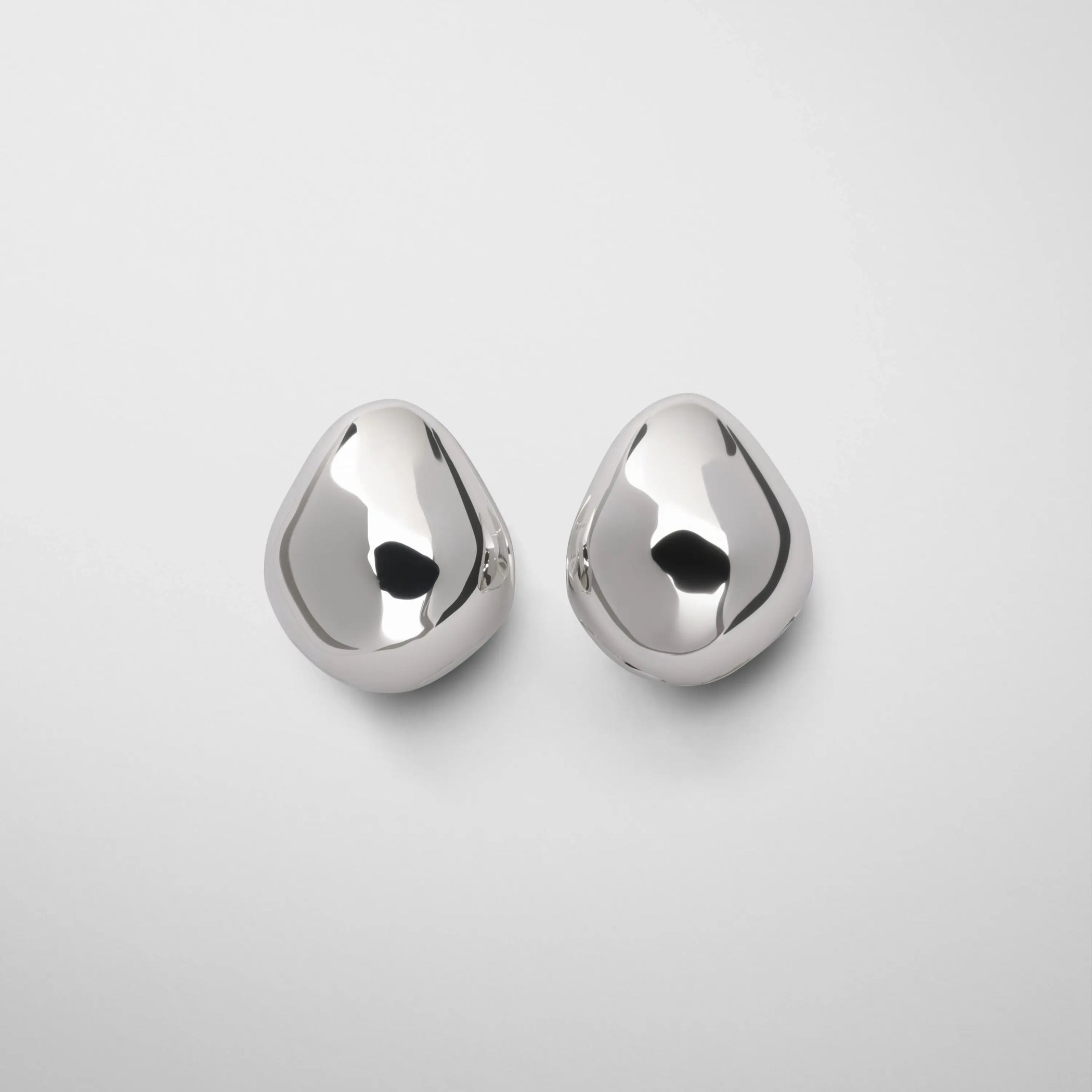 Front view of pebble stud earrings in sliver