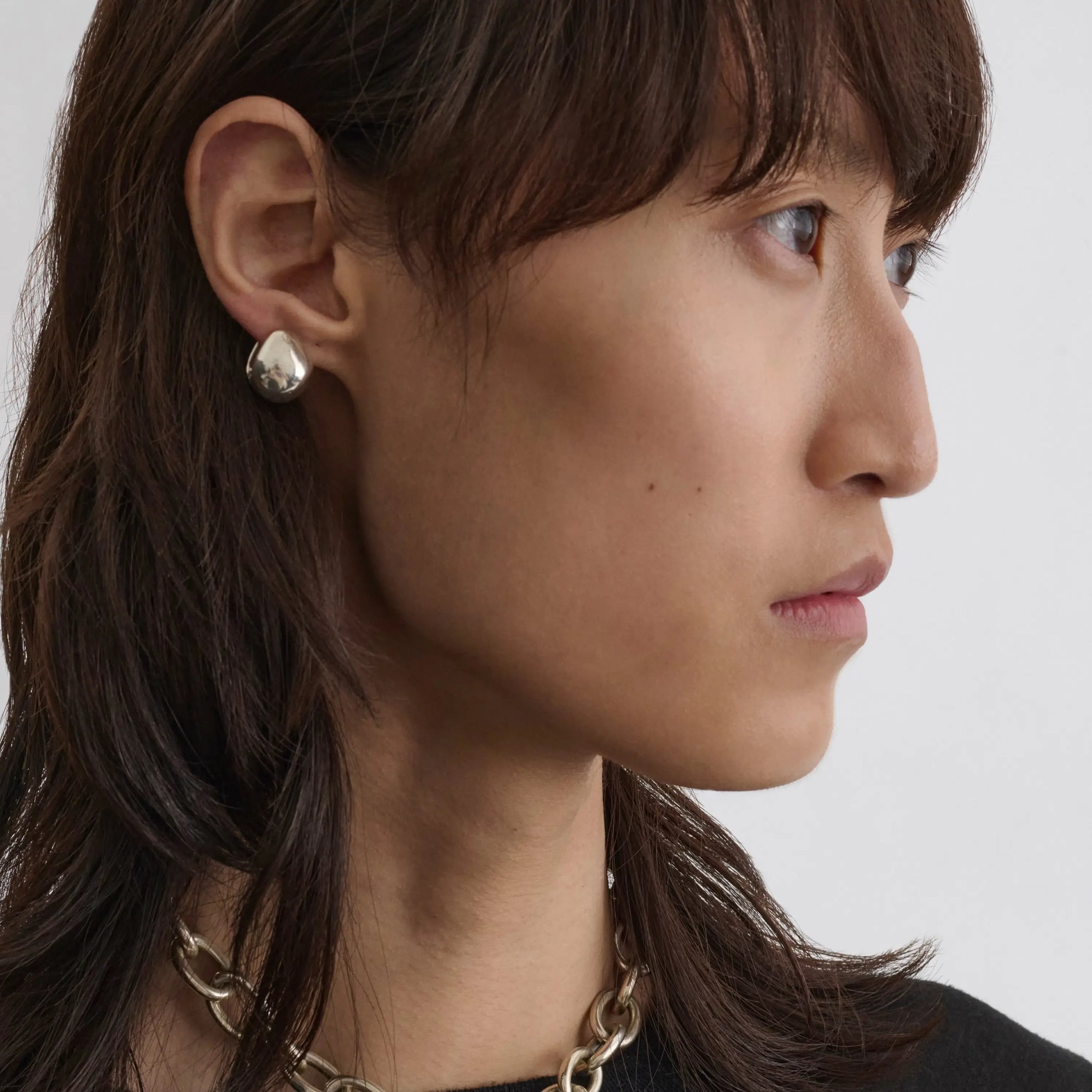 Front view of pebble stud earrings in sterling silver.