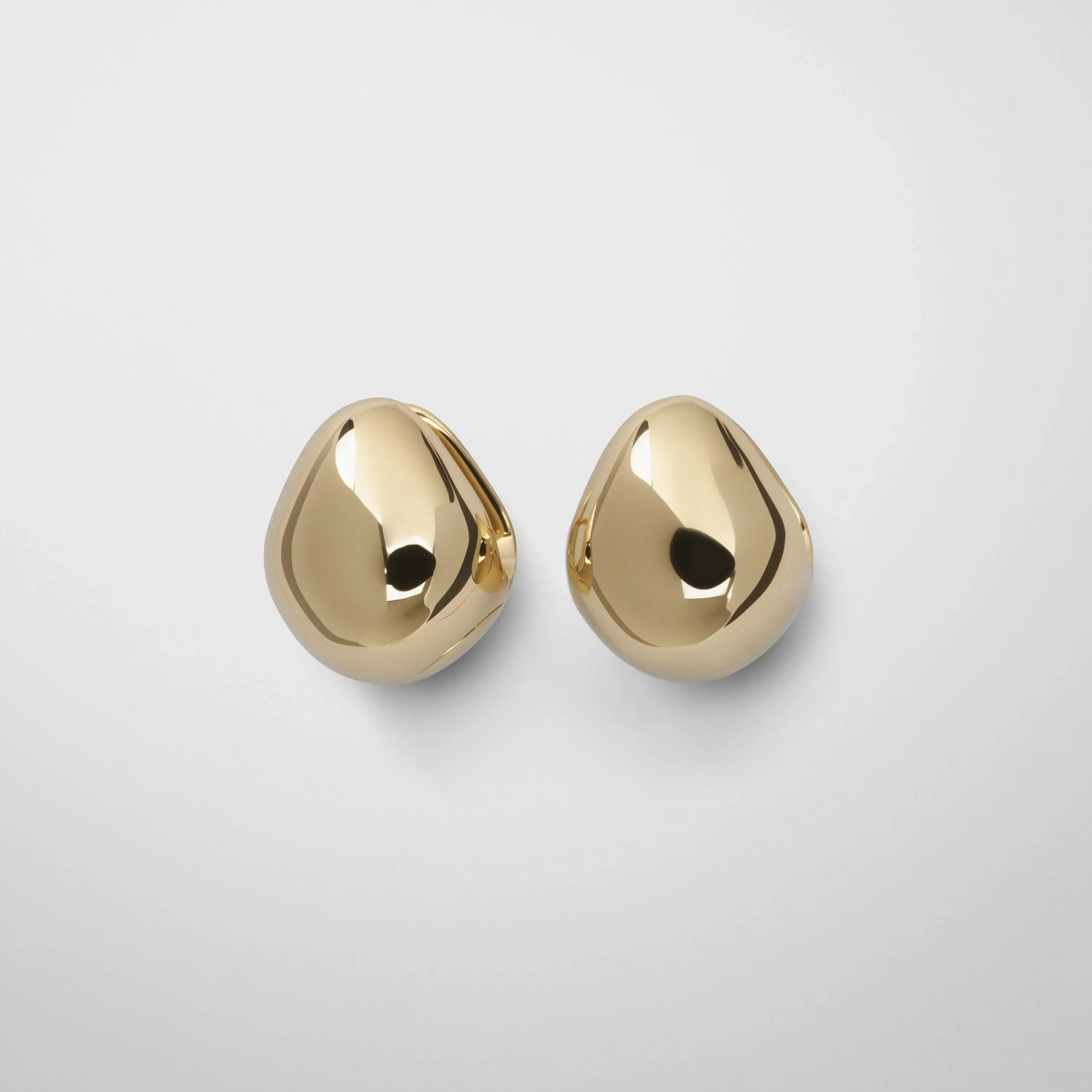 Front view of pebble stud earrings in plated sliver
