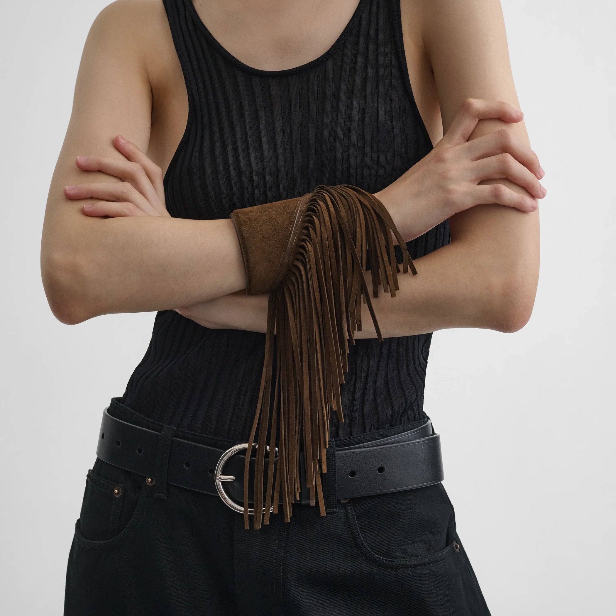 Front view of model wearing fringe cuff in khaki 