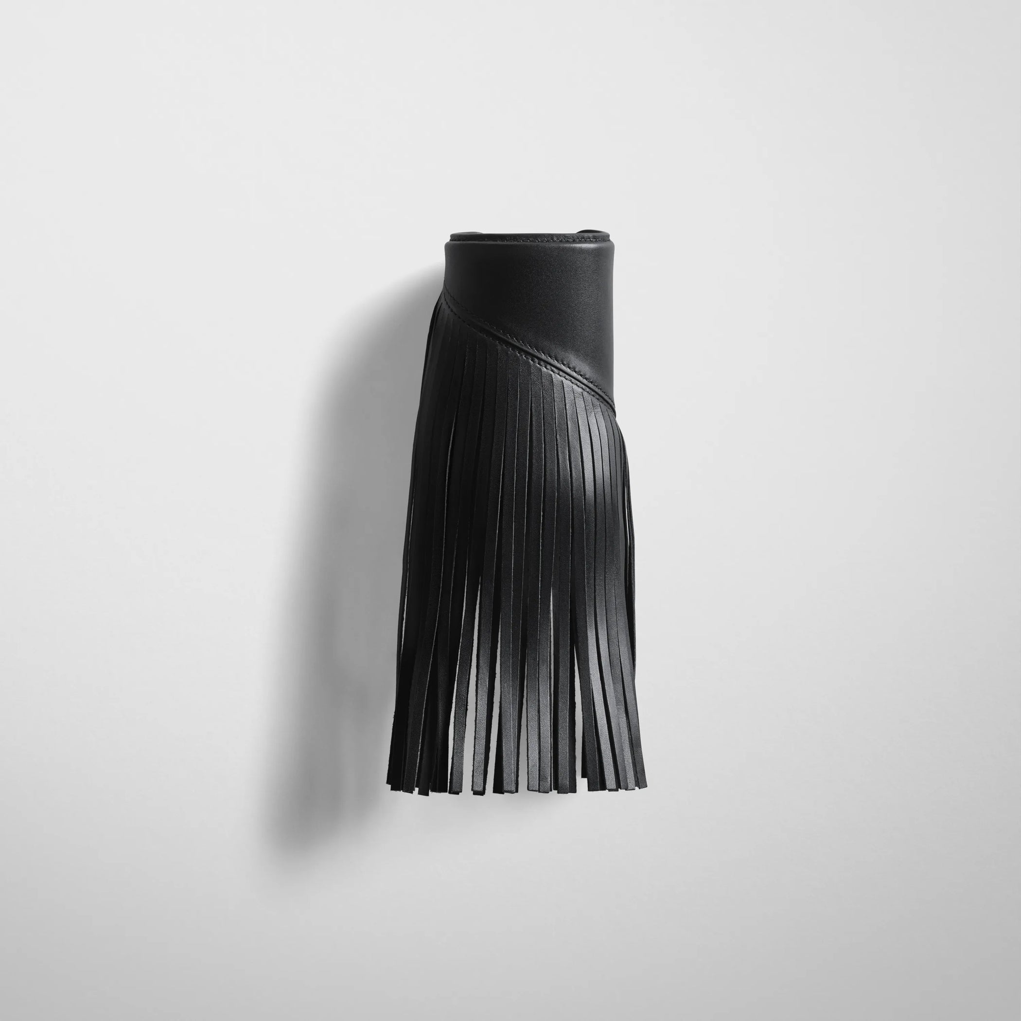 Front view of fringe cuff in black