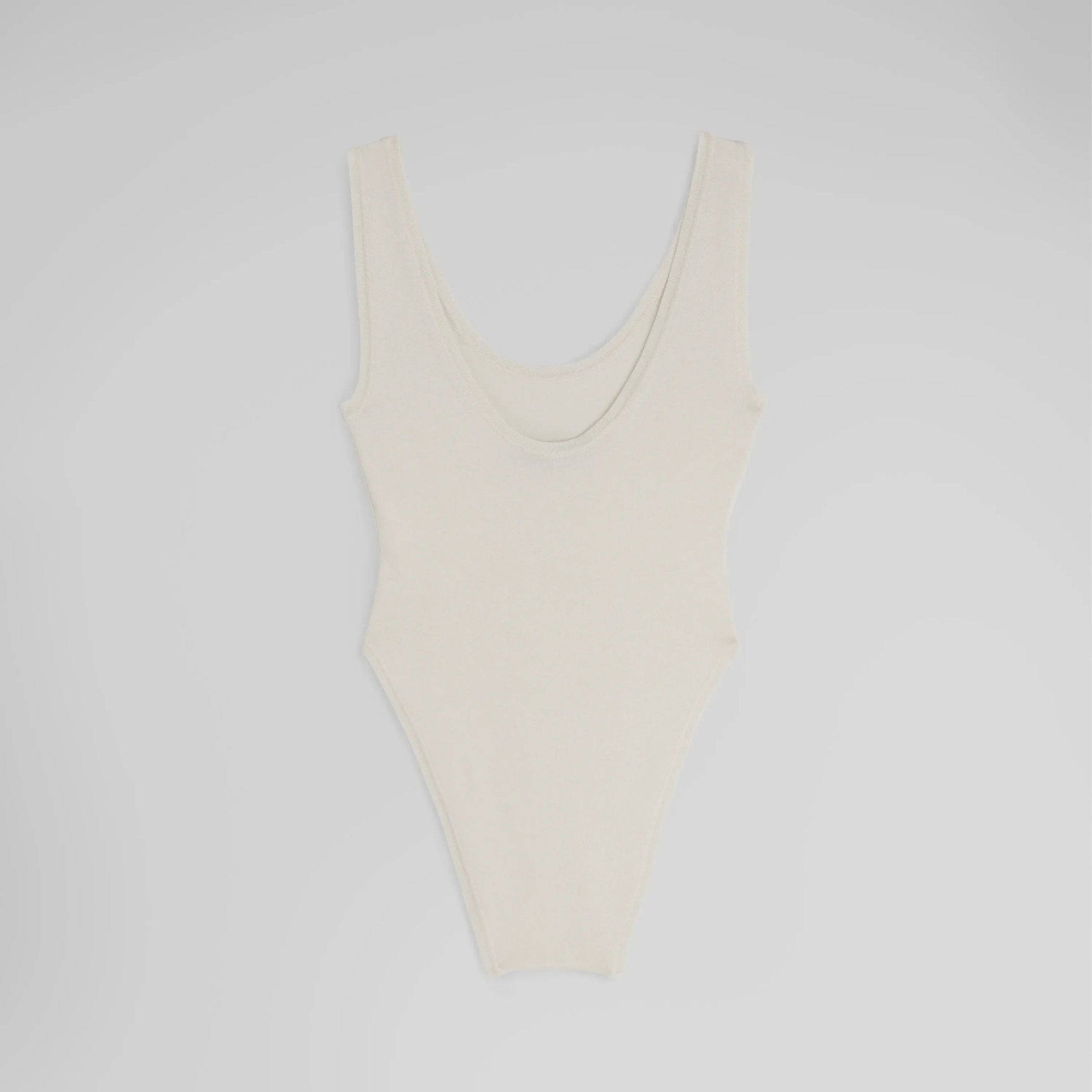 Flat back shot of BODY in off white silk