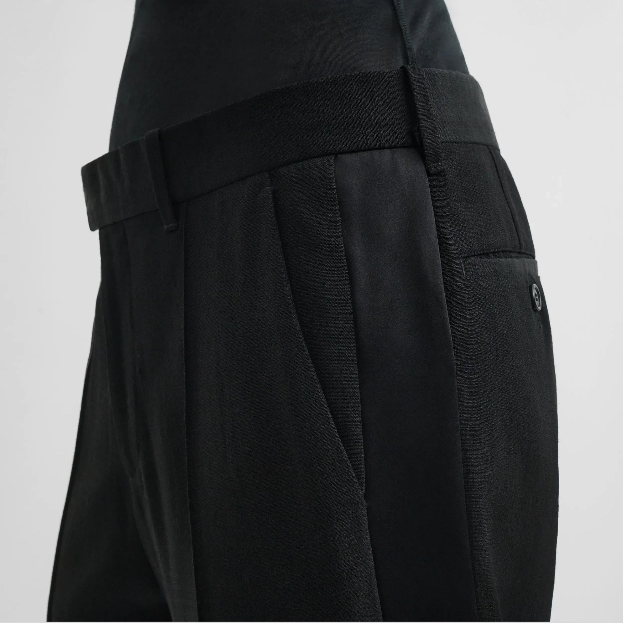 Close up detail view of tux trousers in black viscose
