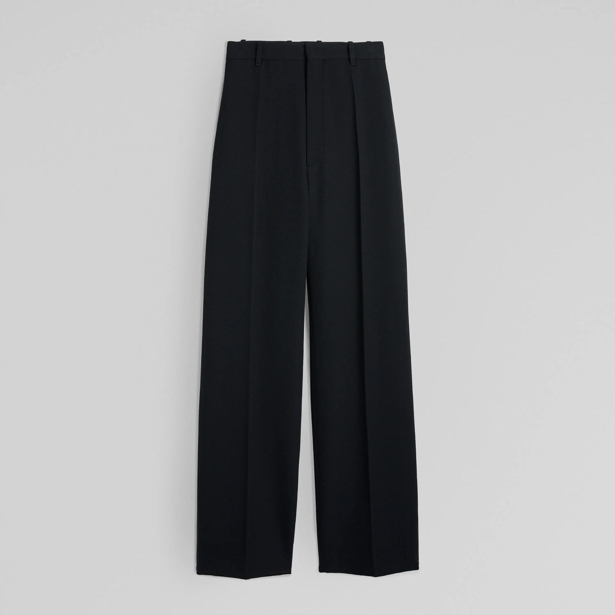 Flat back view of milanese trousers in black wool. 