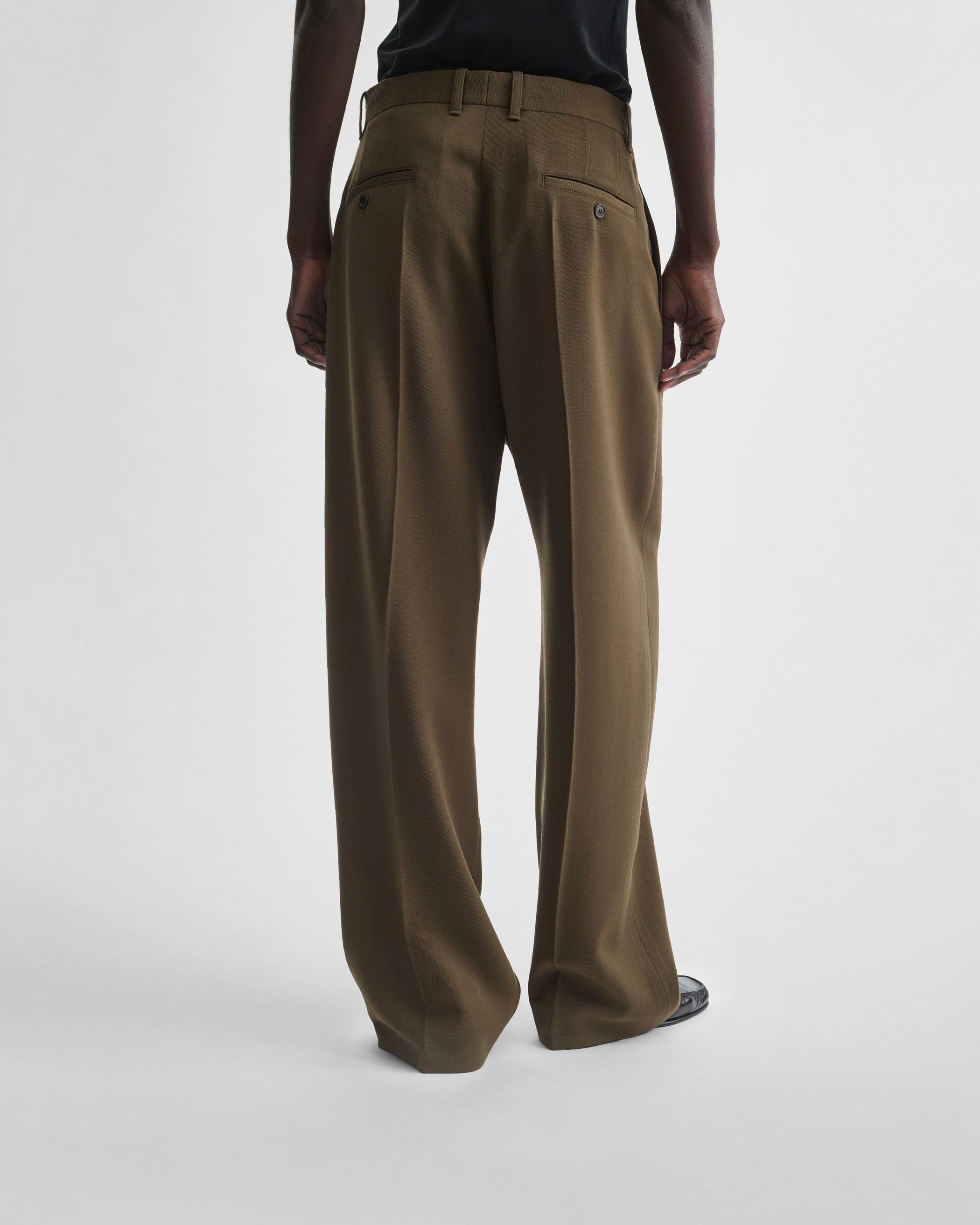 Back view of model wearing DROP TROUSERS in shroom wool