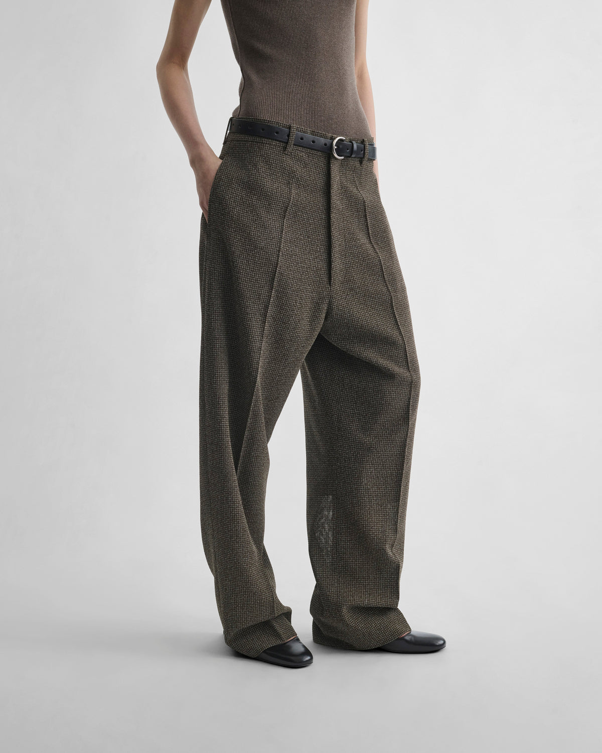 Front view of model wearing DROP TROUSERS in khaki/white wool