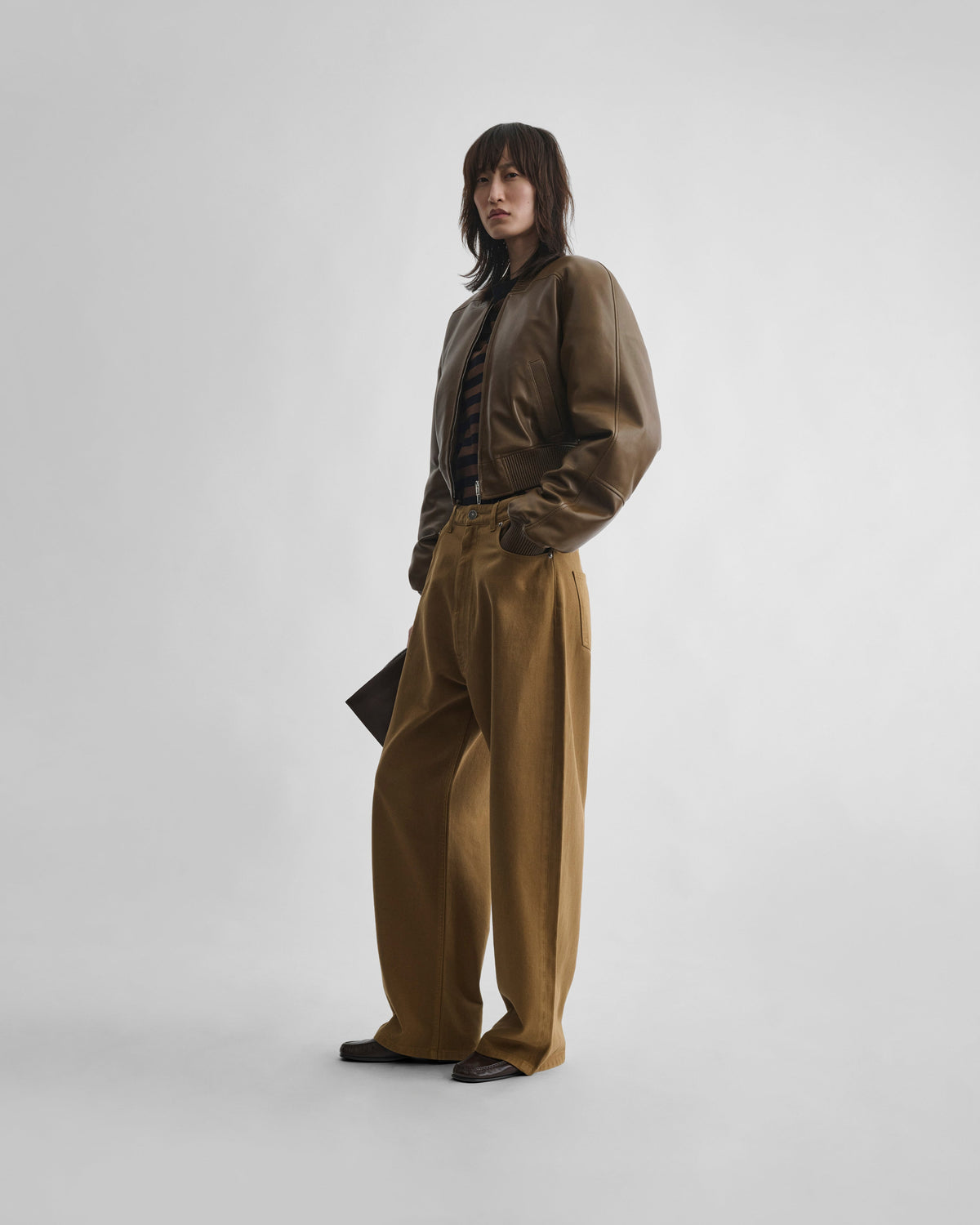 Front view of model wearing DROP JEANS in tobacco cotton