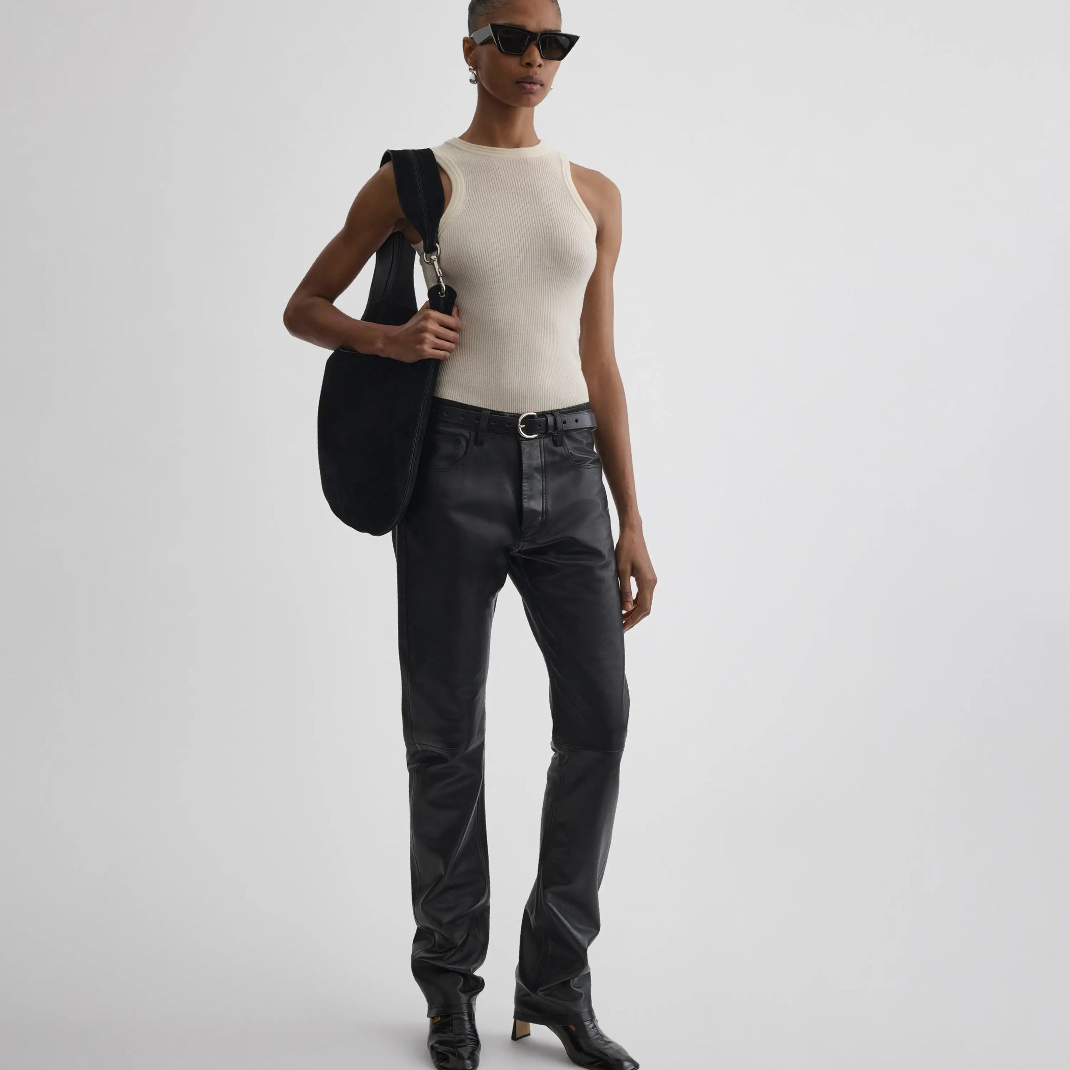 Front view of model wearing Straight Leg Jeans in black.