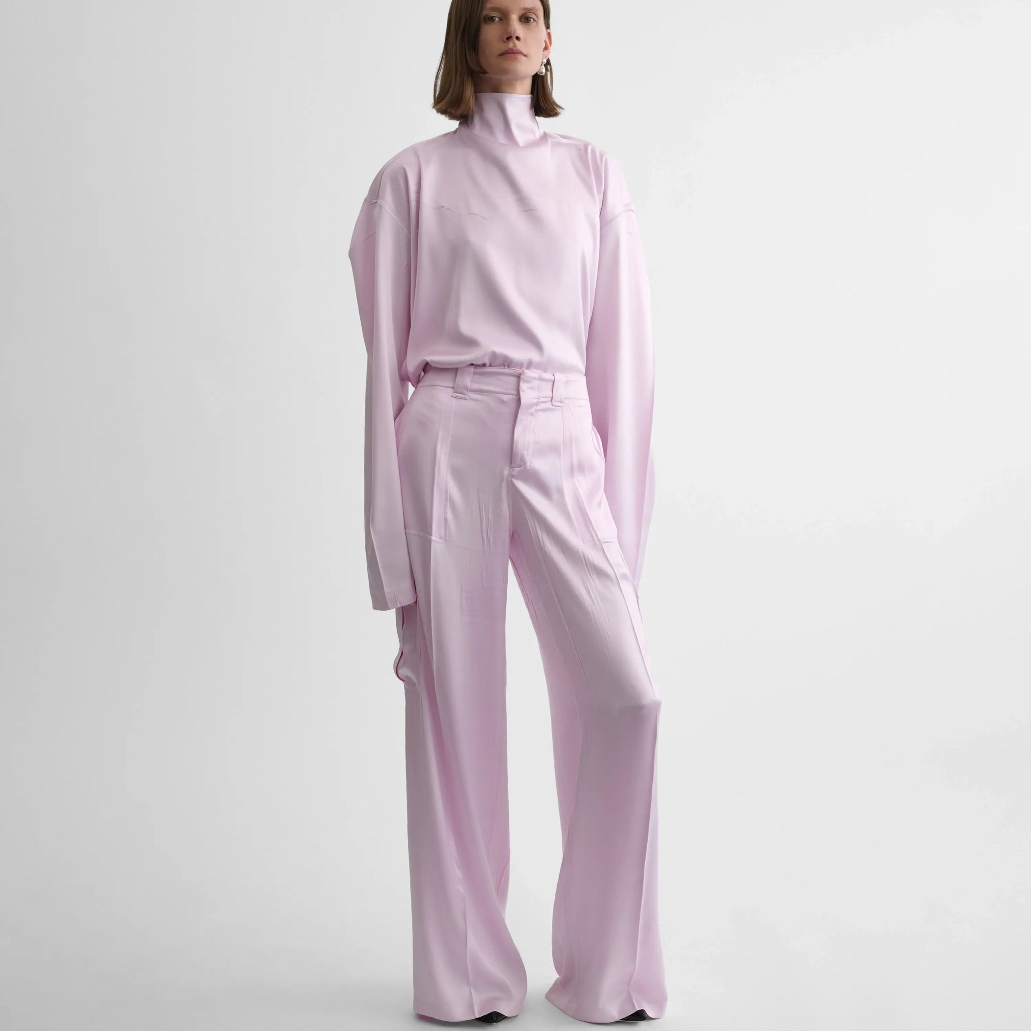 Front view of liquid cargo trousers in candyfloss silk