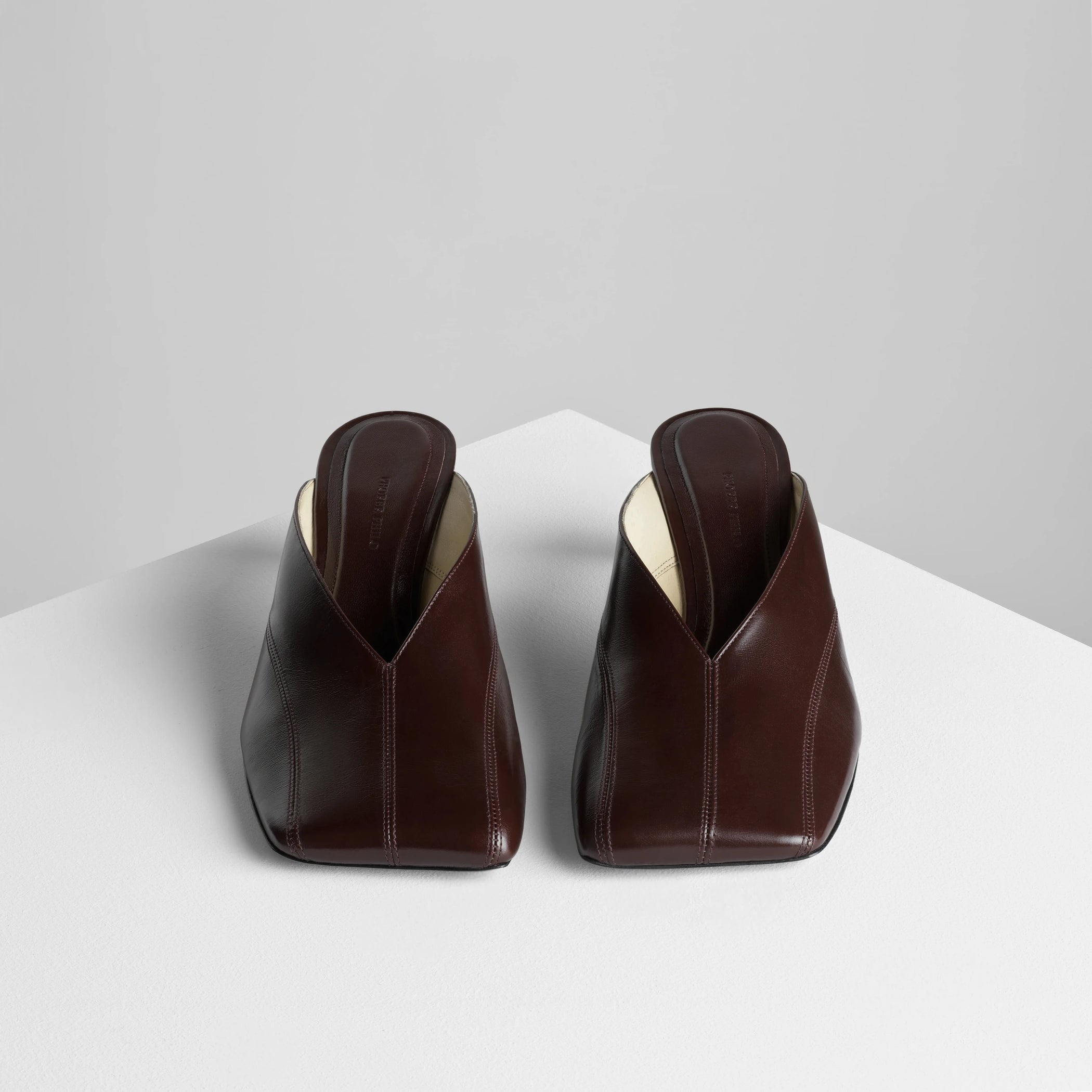 Front view of tilt mule in oxblood leather.
