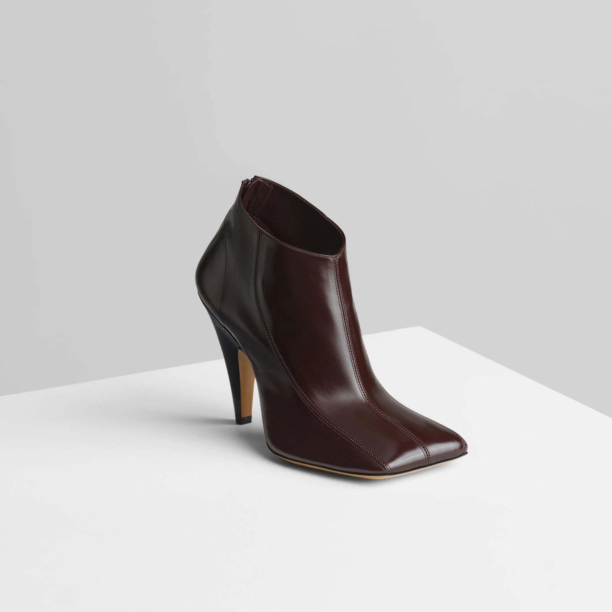 Side view of tilt ankle boot in oxblood leather.