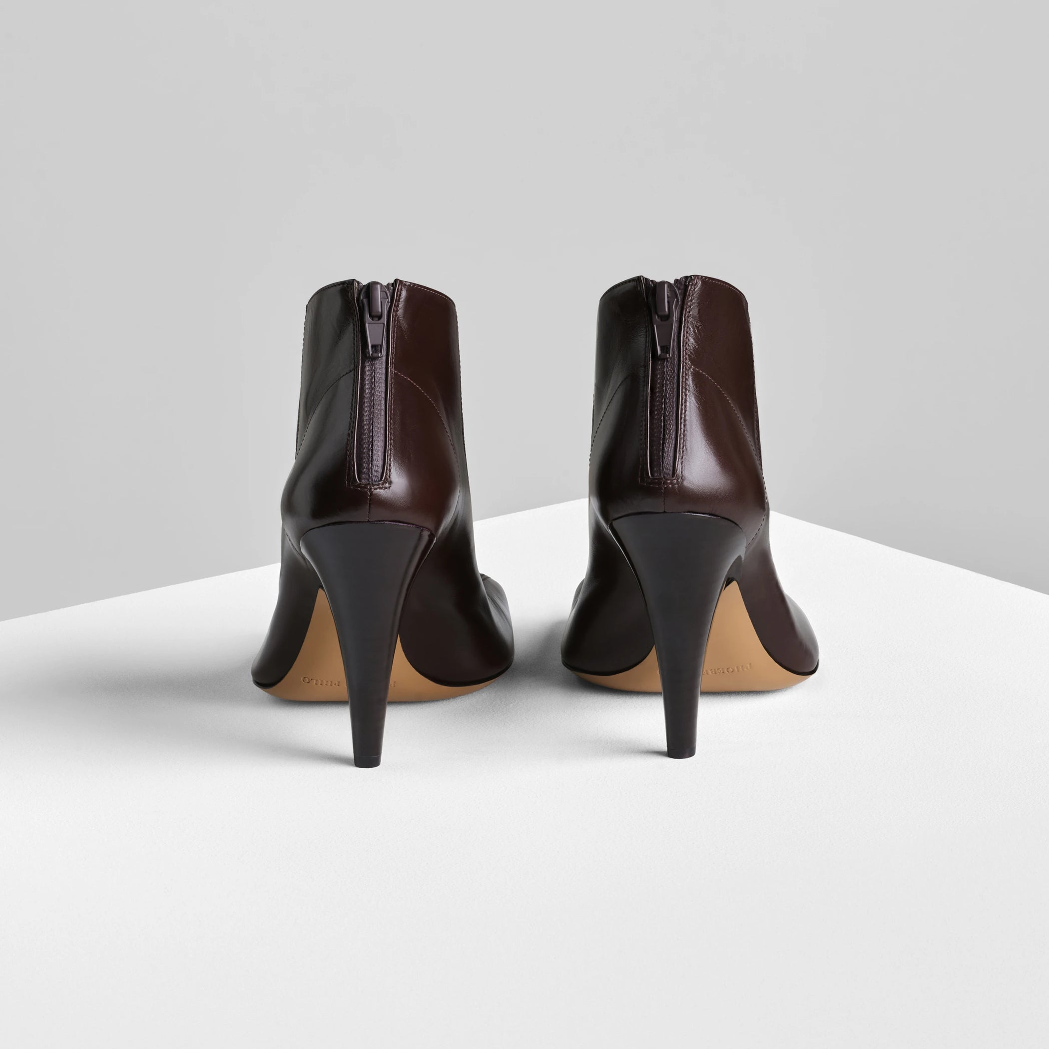 Back view of tilt ankle boot in oxblood leather.