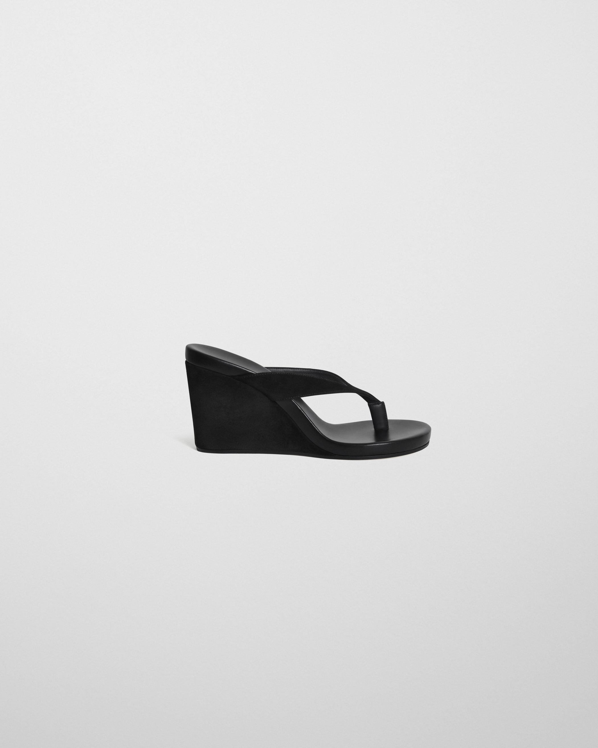 Side view of ROUND WEDGE in black suede