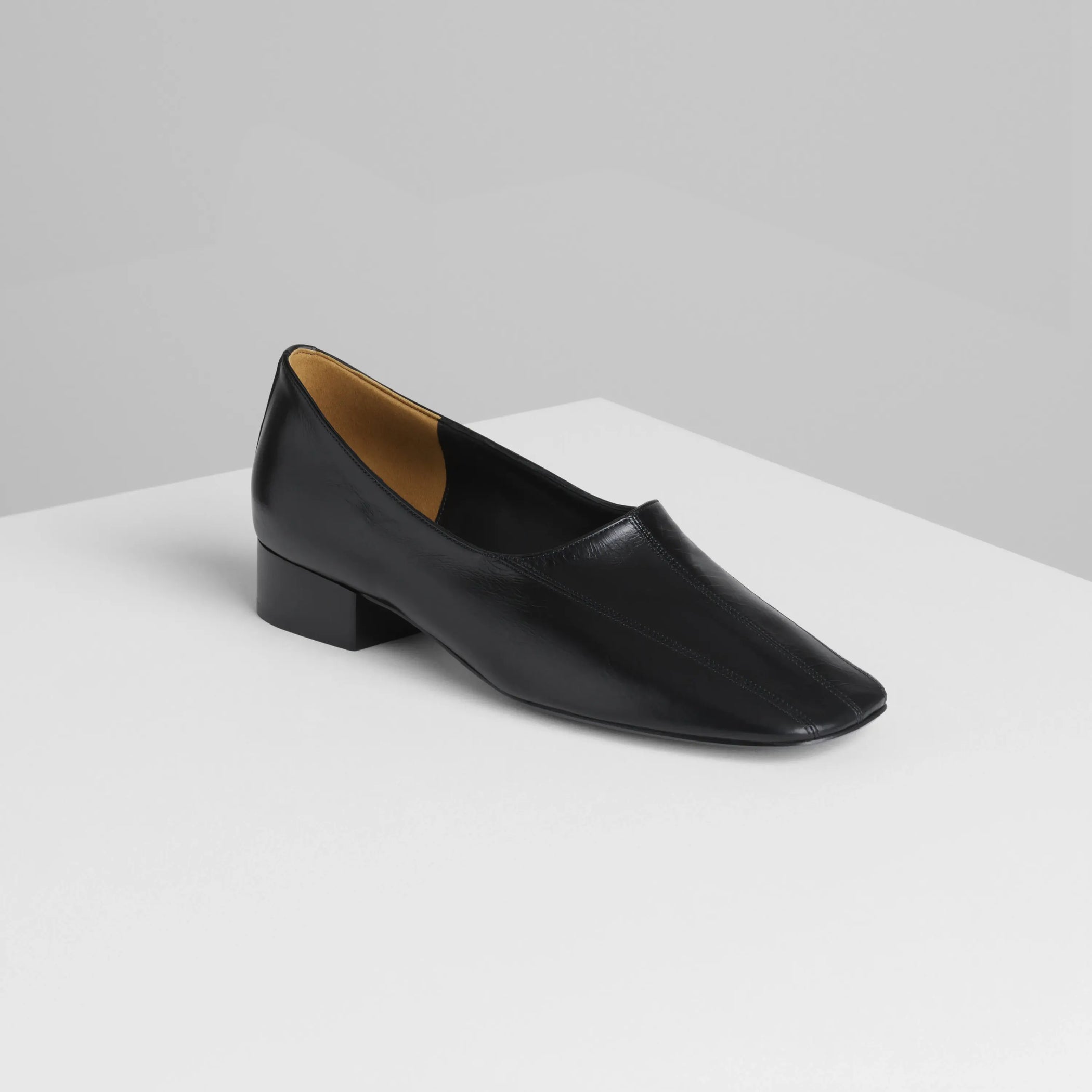 Angled front view of club slipper in shiny calf black 