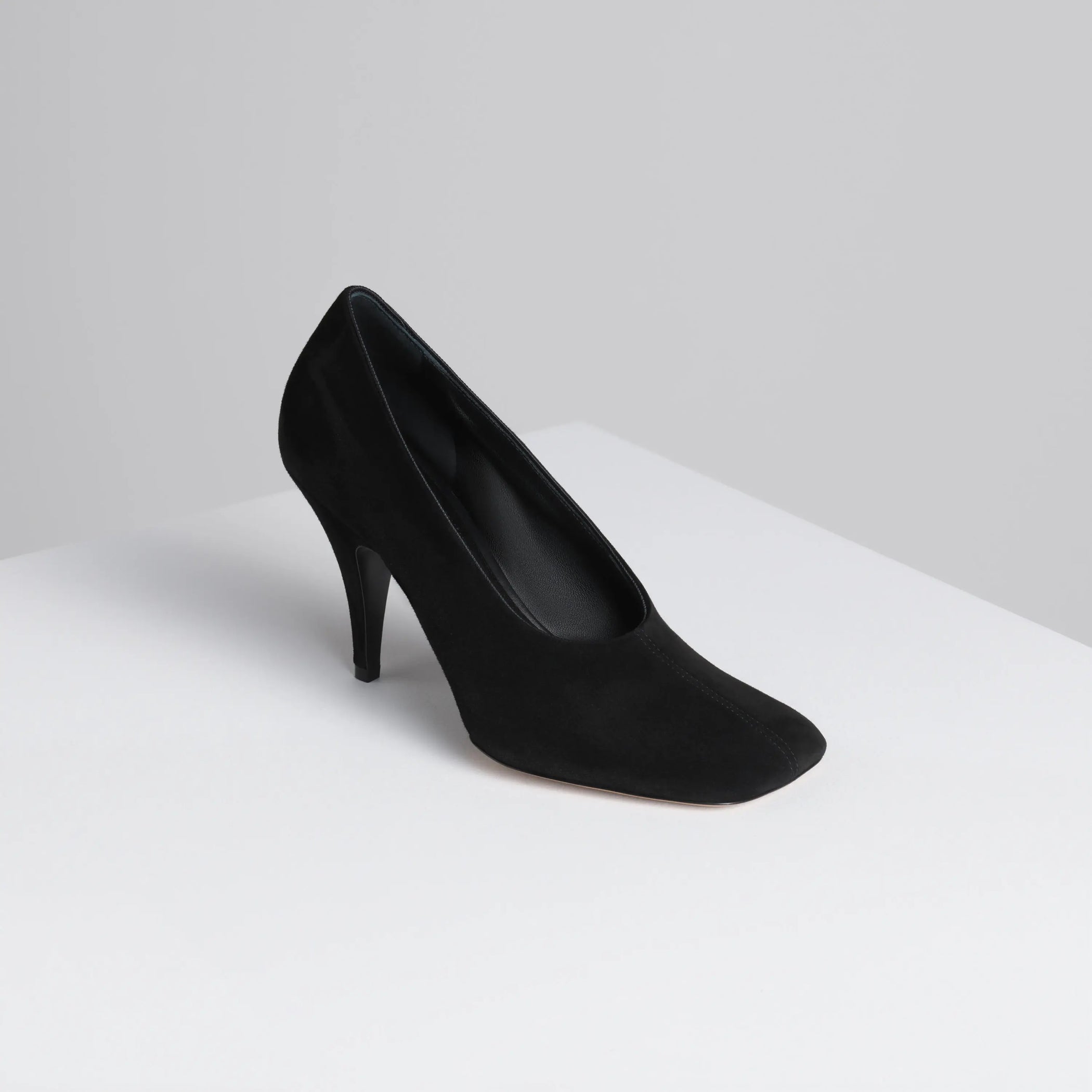 Angled view of soft pump 90 in suede black 