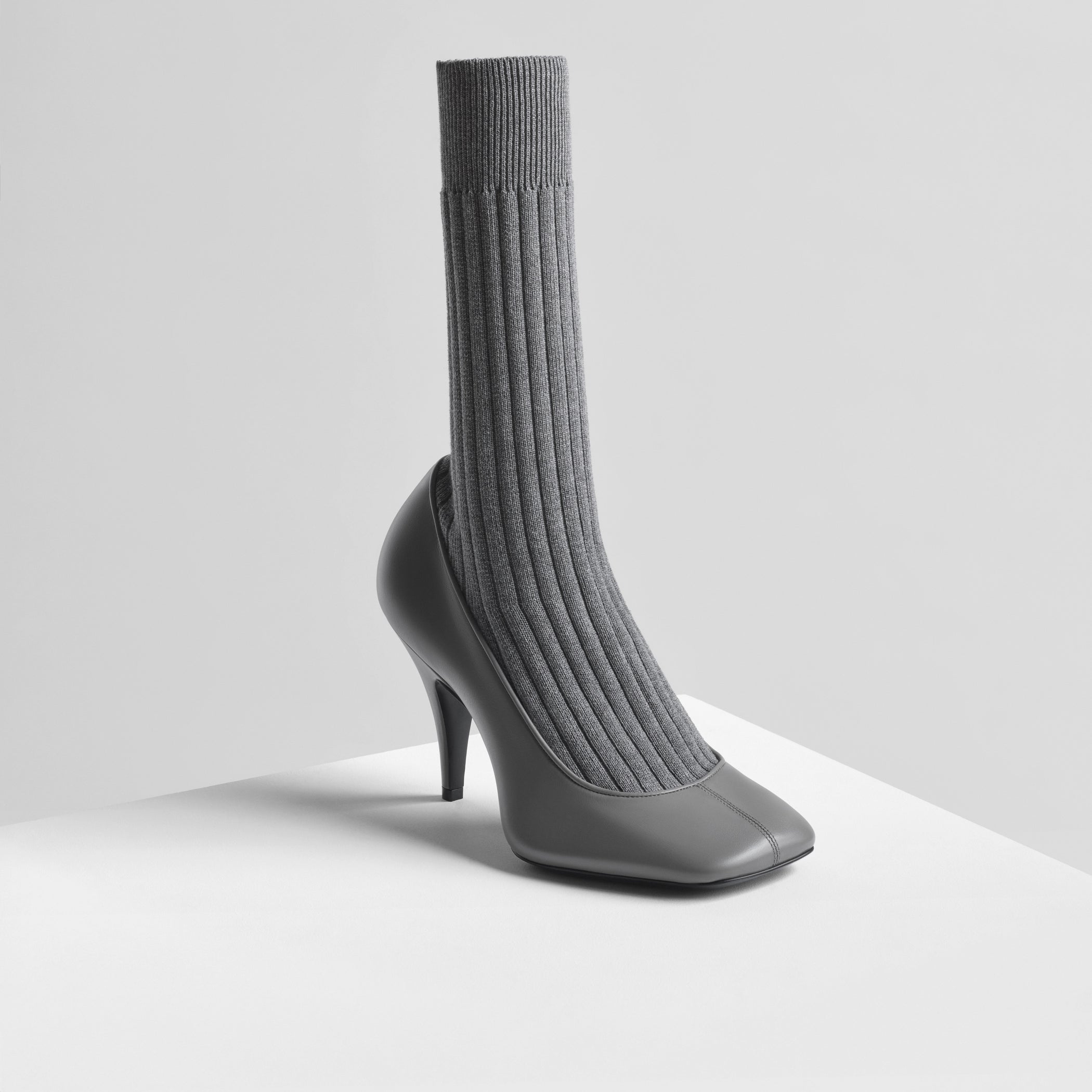 Angled front view of soft sock pump in cement suede 