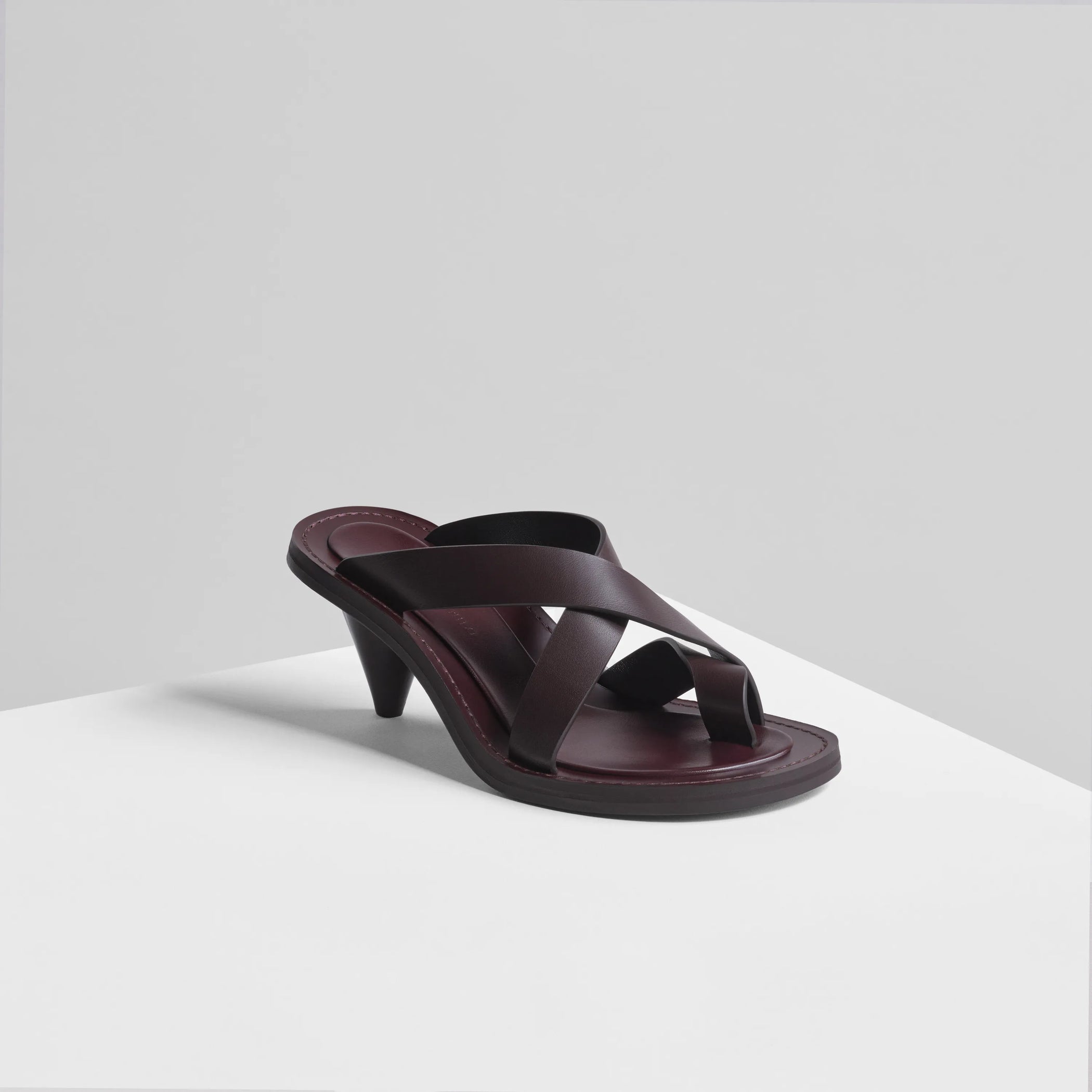 Angled view of strap sandal in oxblood 